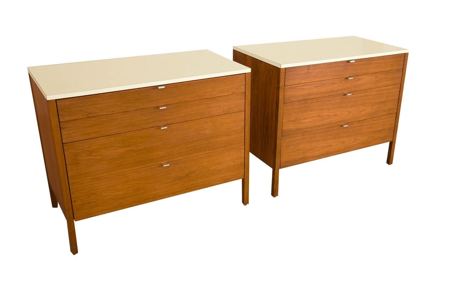 Remarkably iconic rare pair of walnut Mid-Century cabinets/ dressers by Florence Knoll, for Knoll inc., ca. 1960's. A beautiful example of Mid-Century craftsmanship. Expertly crafted, these absolute jewels remain in clean vintage condition. Each