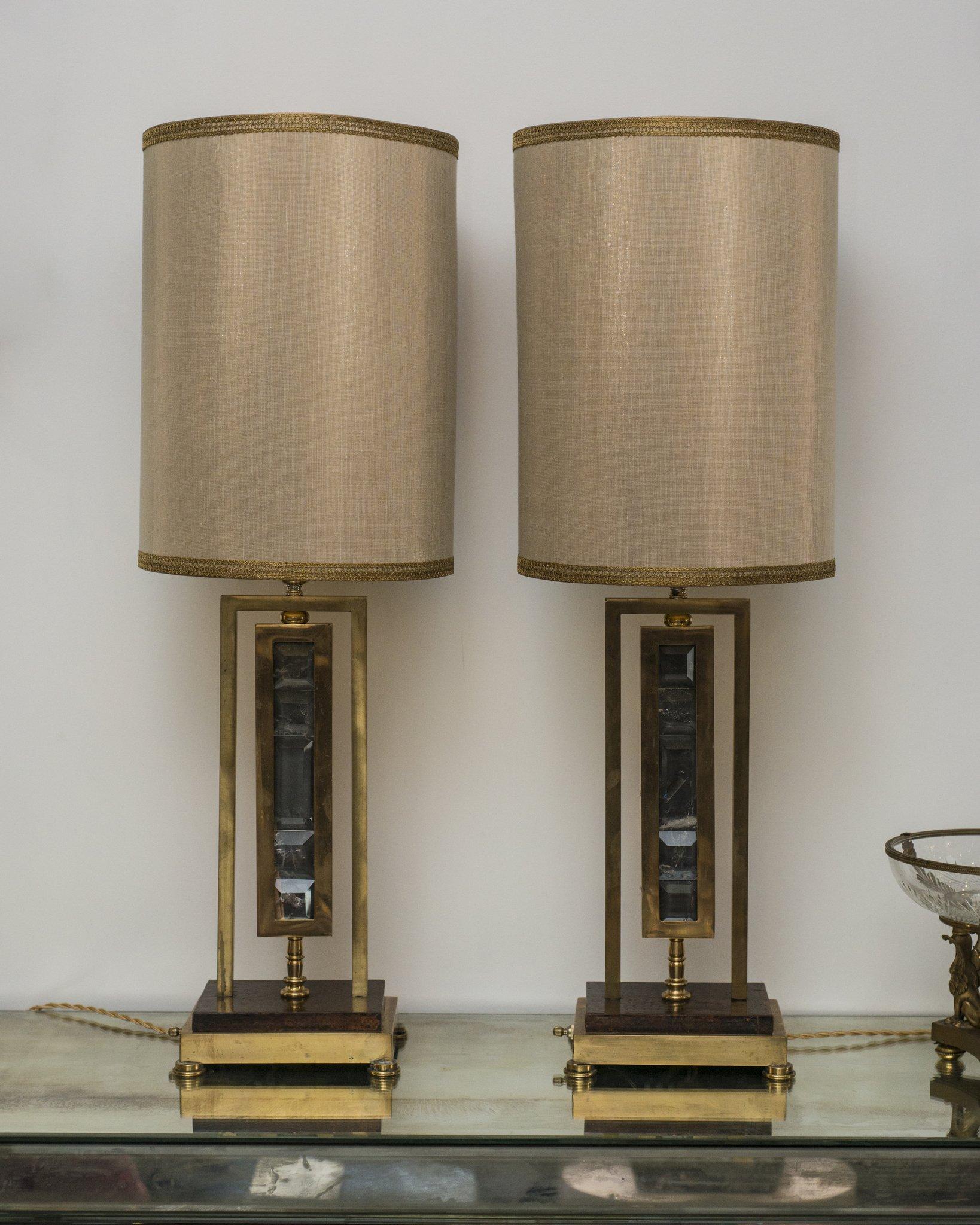 This pair of stunning museum quality midcentury French bronze lamps made with smoky quartz have been sourced in Paris. The custom shades are handmade using gold metallic silk, with gold leaf interiors, and are completed with vintage metallic trim.