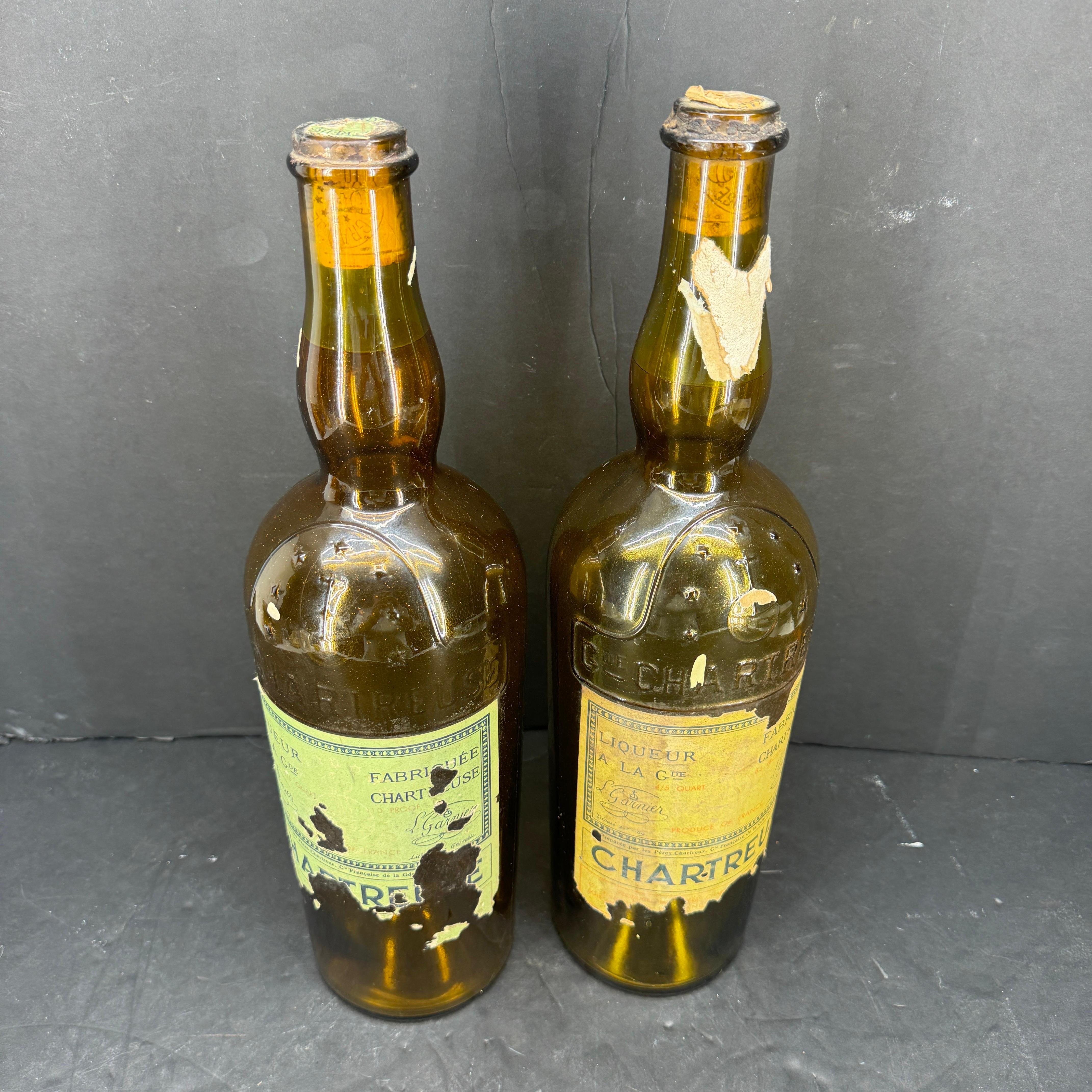 Substantial and large vintage Chartreuse liquor bottles made of solid glass material. The Chartreuse is not a simple liquor: along the centuries, it became legendary. In fact, it is an integral piece of French History, although its ingredients still