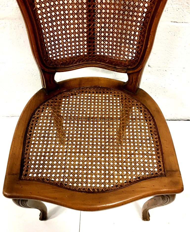 MidCentury Pair Of French Style Carved Wood and Cane Chairs For Sale