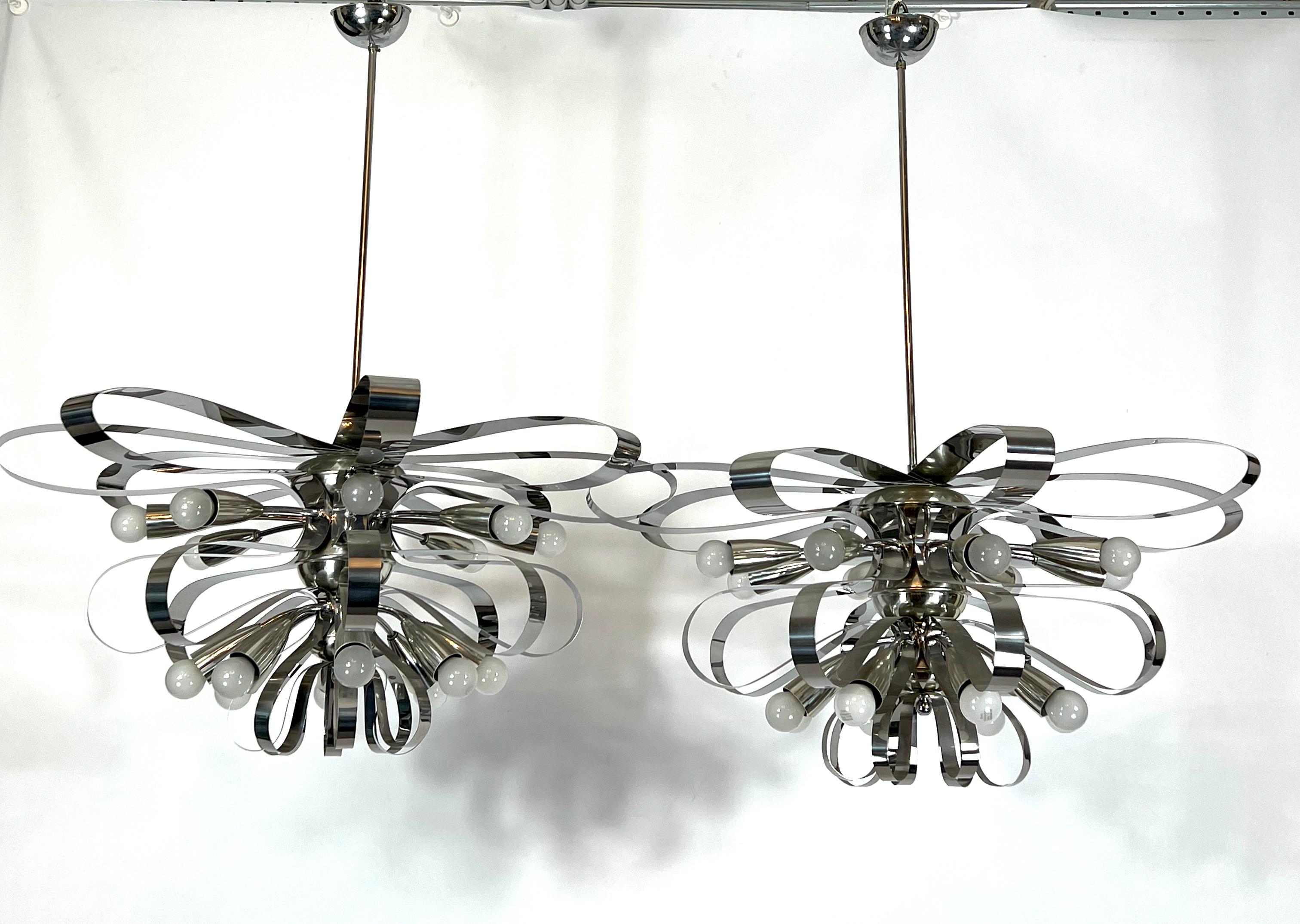 Great vintage condition for this set of two large chrome chandelier produced in Italy during the 70s. Diameter 80 cm. Full working with EU standard, adaptable on demand for USA standard.