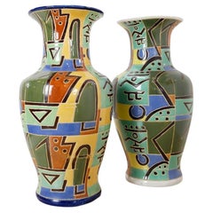 Mid-Century "Pair" of large polychrome enameled ceramic vases