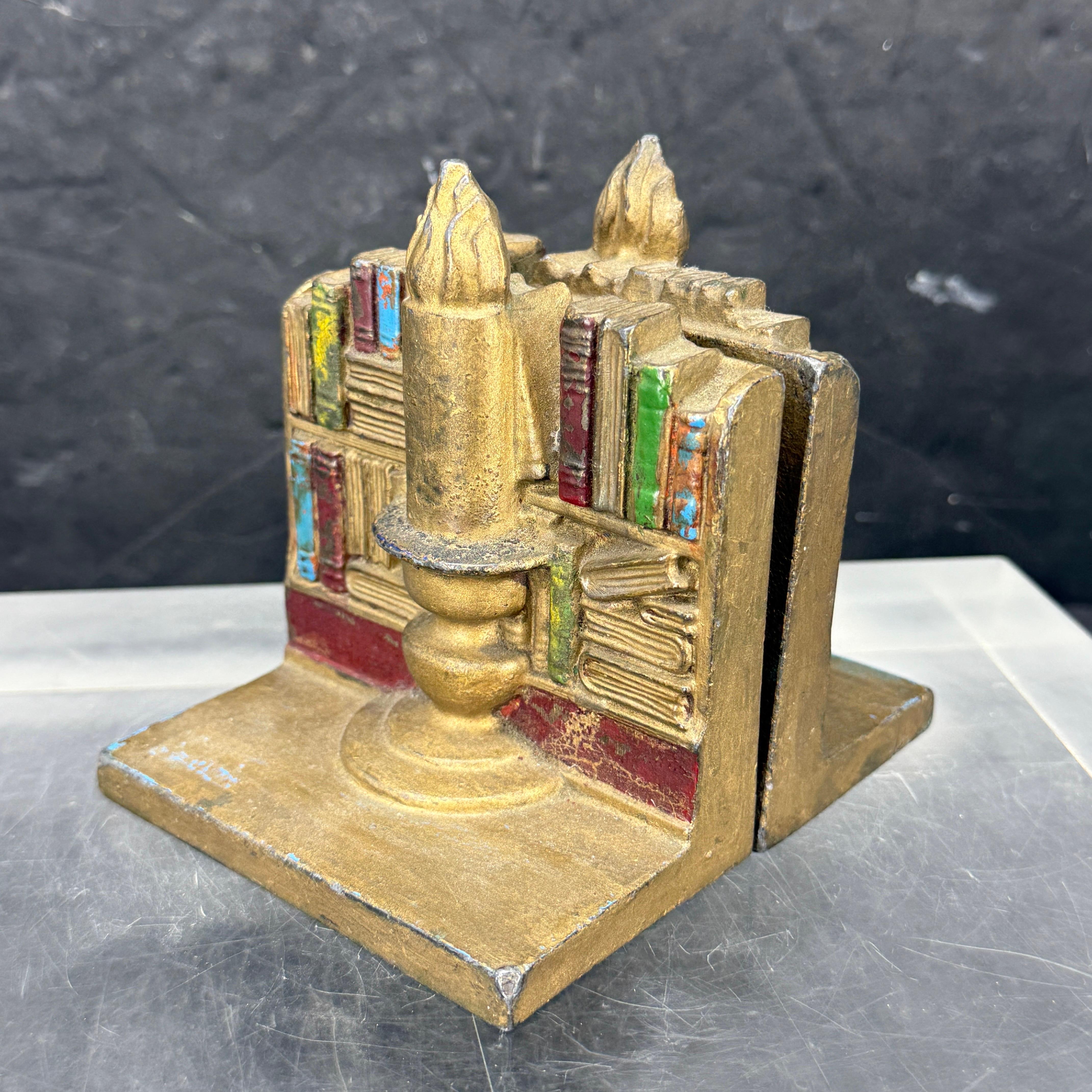 Cast Mid-Century Pair of Library Bookends with Books and Candle For Sale