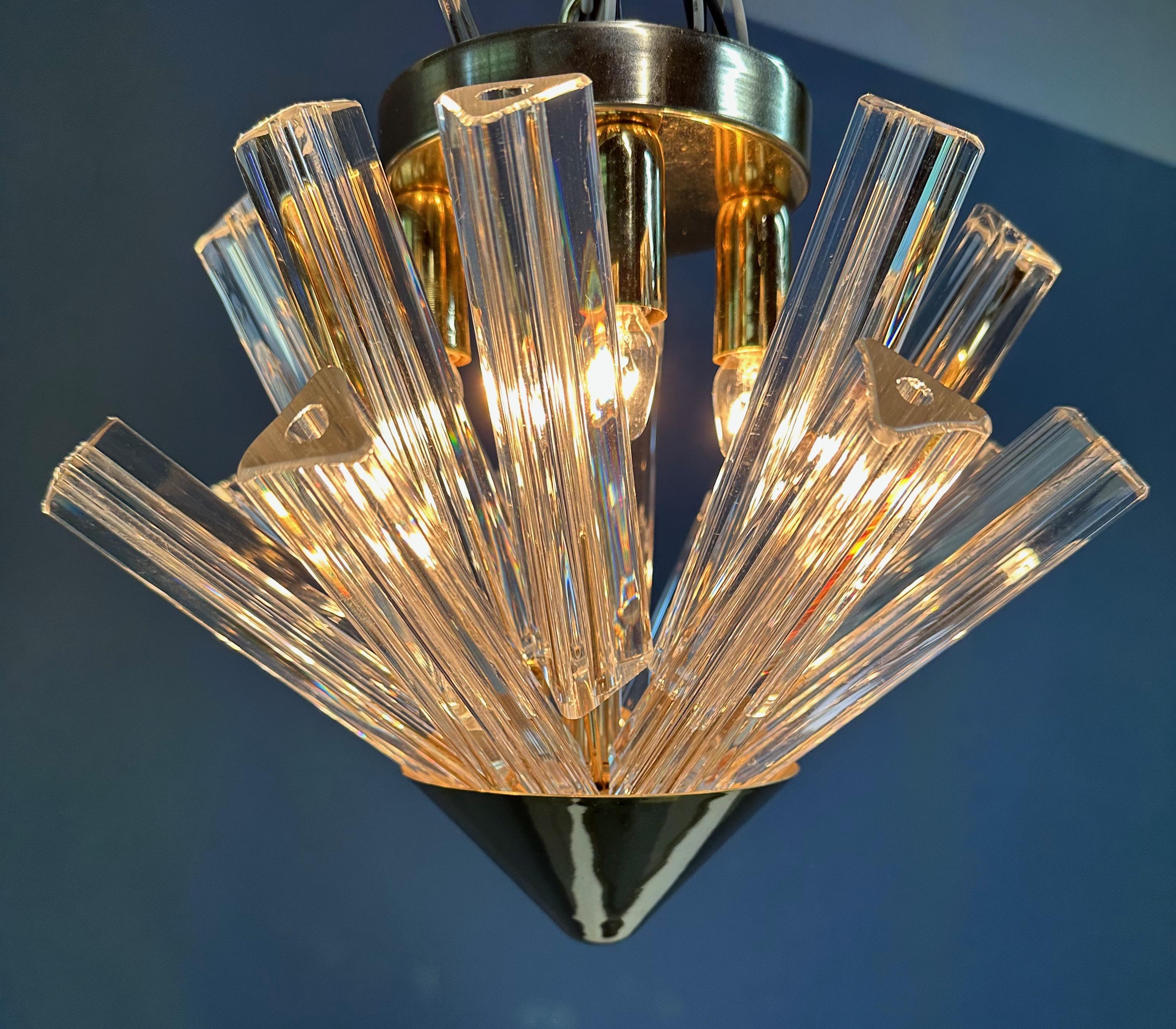 An excellent Pair of Mid-Century Murano Glass Venini Style Triedri Prism Flushmount Pendant Chandeliers. These Sputnik patterned Italian fixtures would make a stunning addition to any home. Their unique combination of mid-century design and Murano
