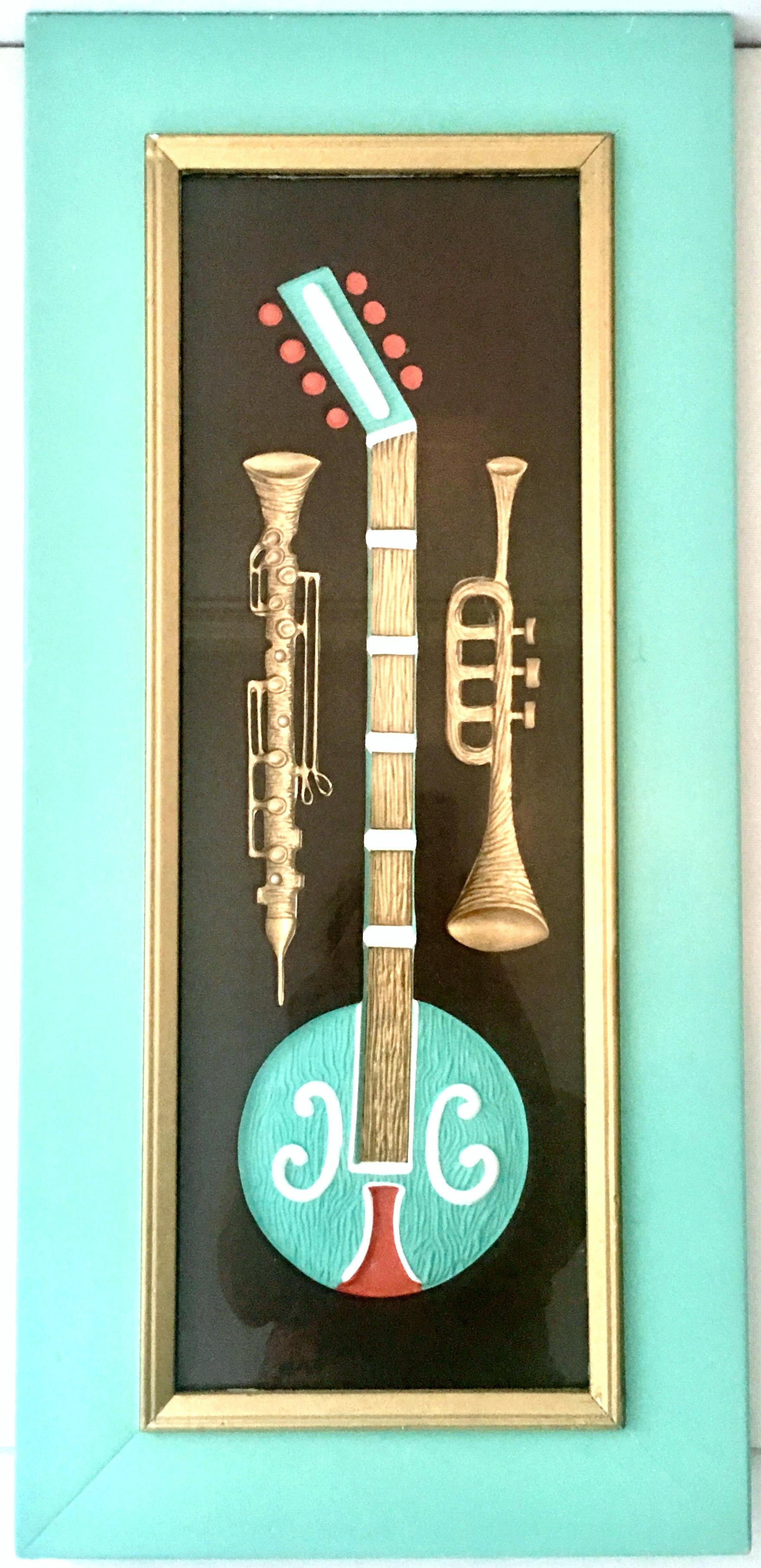 Mid-20th century coveted pair of original handcrafted dimensional musical instrument shadow box painted panel's by, Turner. This rare and coveted complimentary pair of handcrafted dimensional retro musical instruments are recessed, raised and