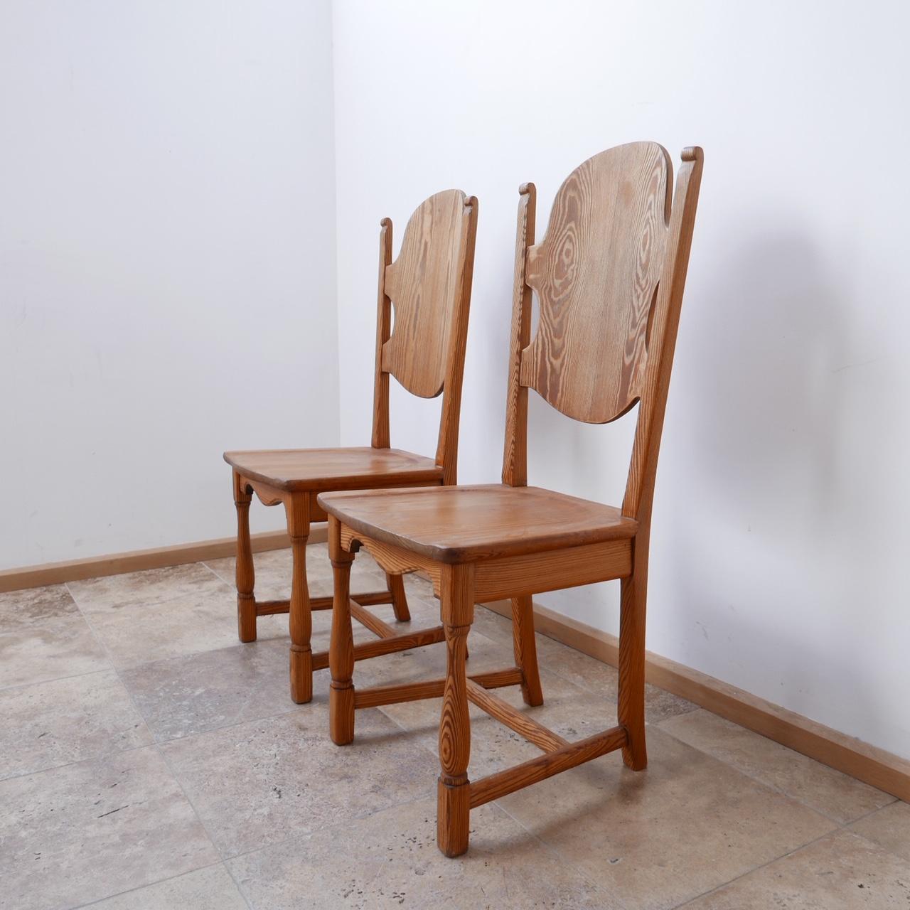 A pair of stylish pine occasional chairs. 

A good colour showing the veins in the wood. 

Sweden, c1970s. 

Perfect or a bedroom, hallway or straddling a mantelpiece. 

Dimensions: 45 W x 42 D x 45 seat height x 104 total height in cm.