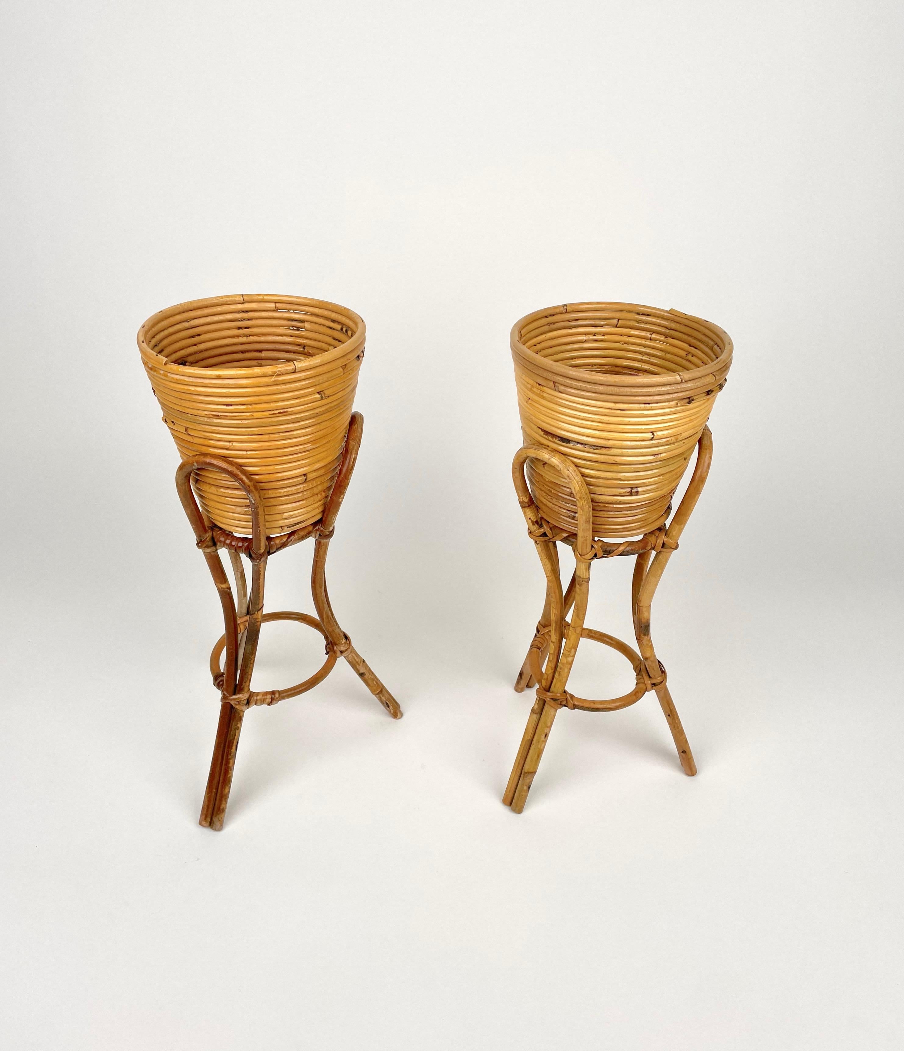 Pair of heightened vase holders planters in rattan and bamboo made in Italy in the 1960s.