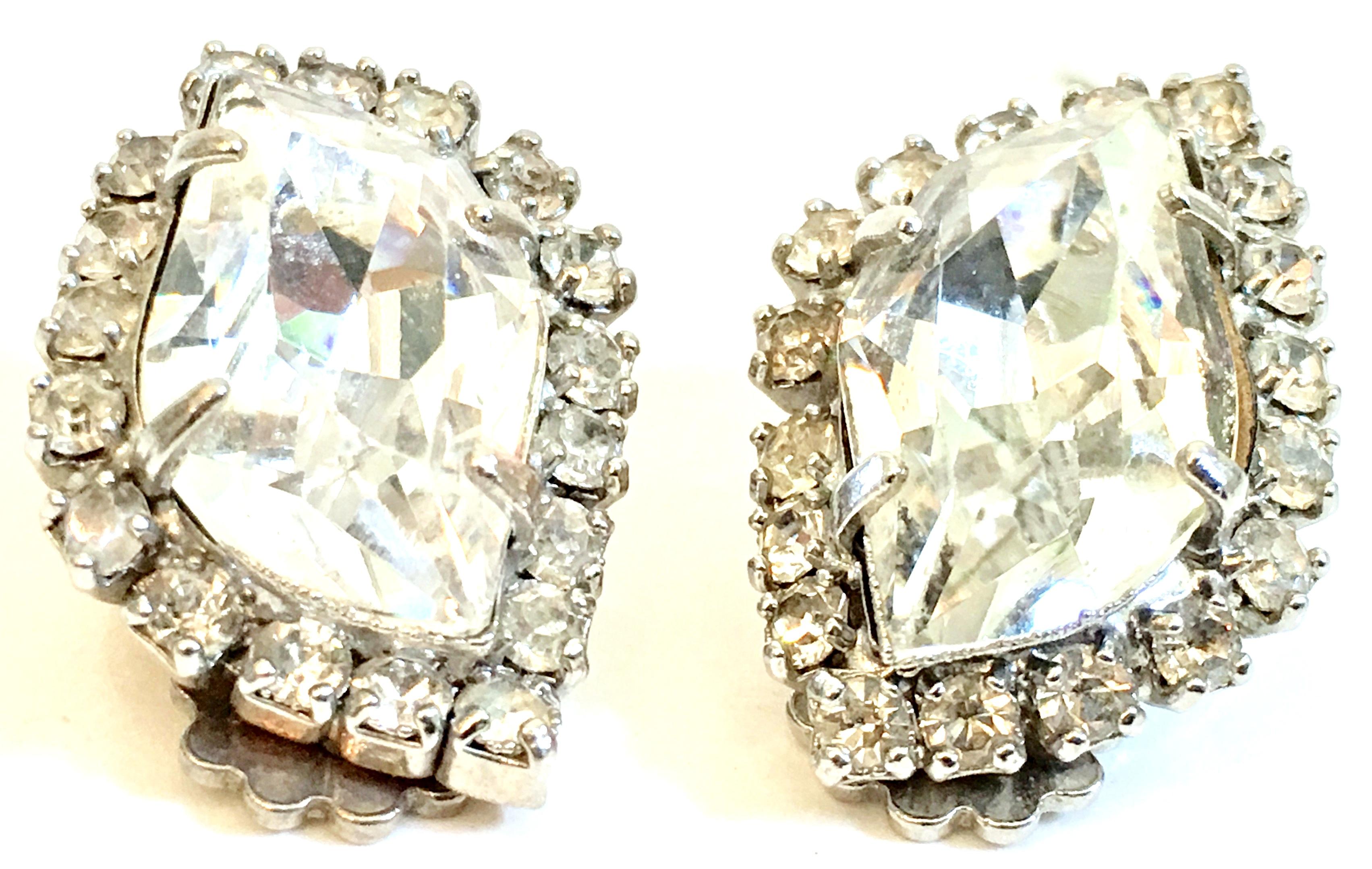 1960'S Silver & Swarovski Crystal Rhinestone Earrings By, Weiss. Features silver rhodium plate and prong set brilliant Swarovski crystal clear large and rare irregular hexagon cut and faceted center stone, surround by round stones
These earrings are
