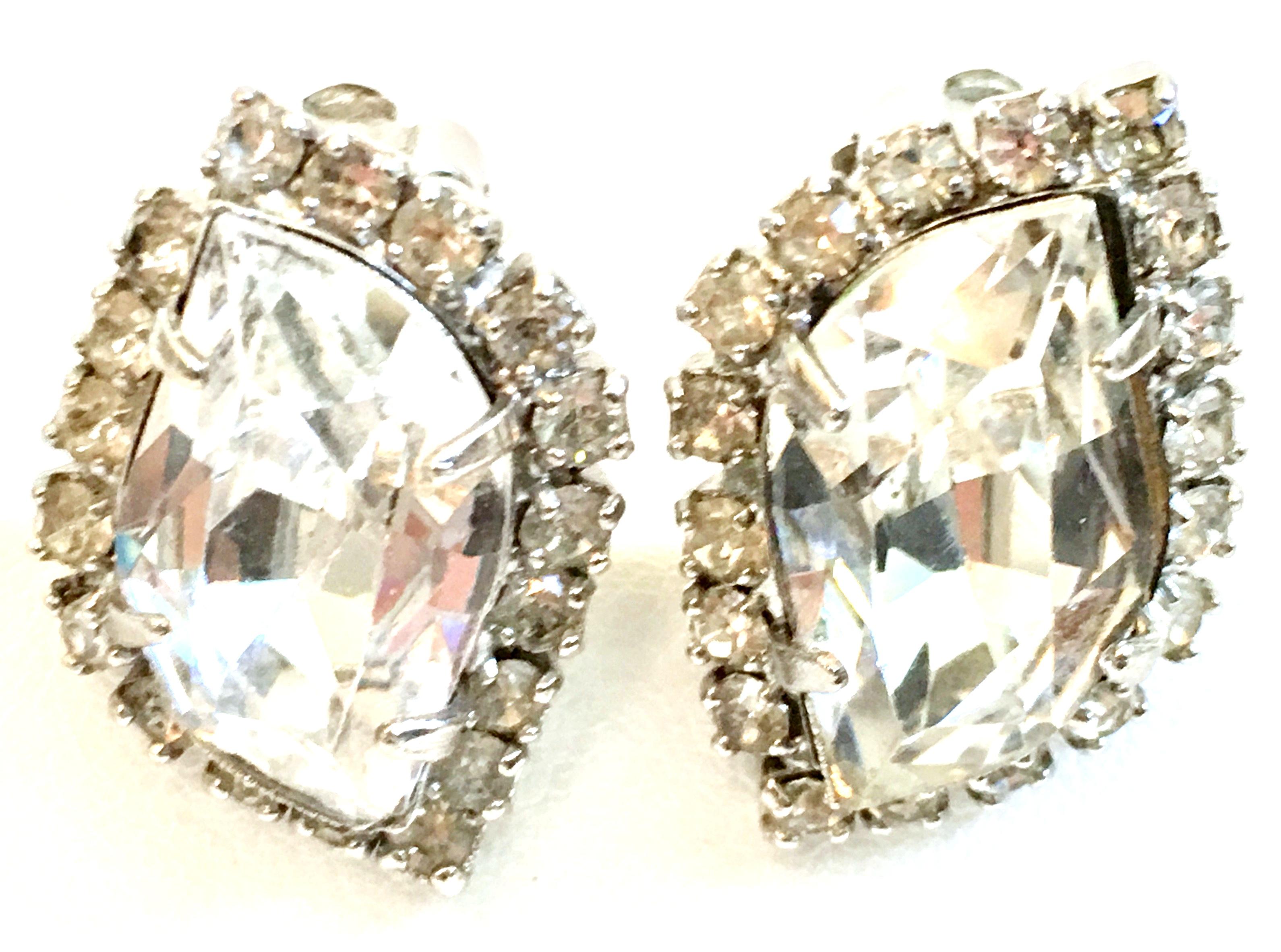 1960'S Pair Silver & Swarovski Crystal Rhinestone Earrings By, Weiss. Features silver rhodium plate and prong set brilliant Swarovski crystal clear large and rare irregular hexagon cut and faceted center stone, surround by round stones
These