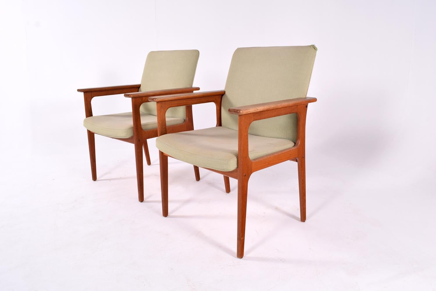 Pair of armchairs designed and manufactured in Denmark by O. D. Mobler of Copenhagen during the 1960s. Made from solid teak. The chairs are upholstered in dry green.