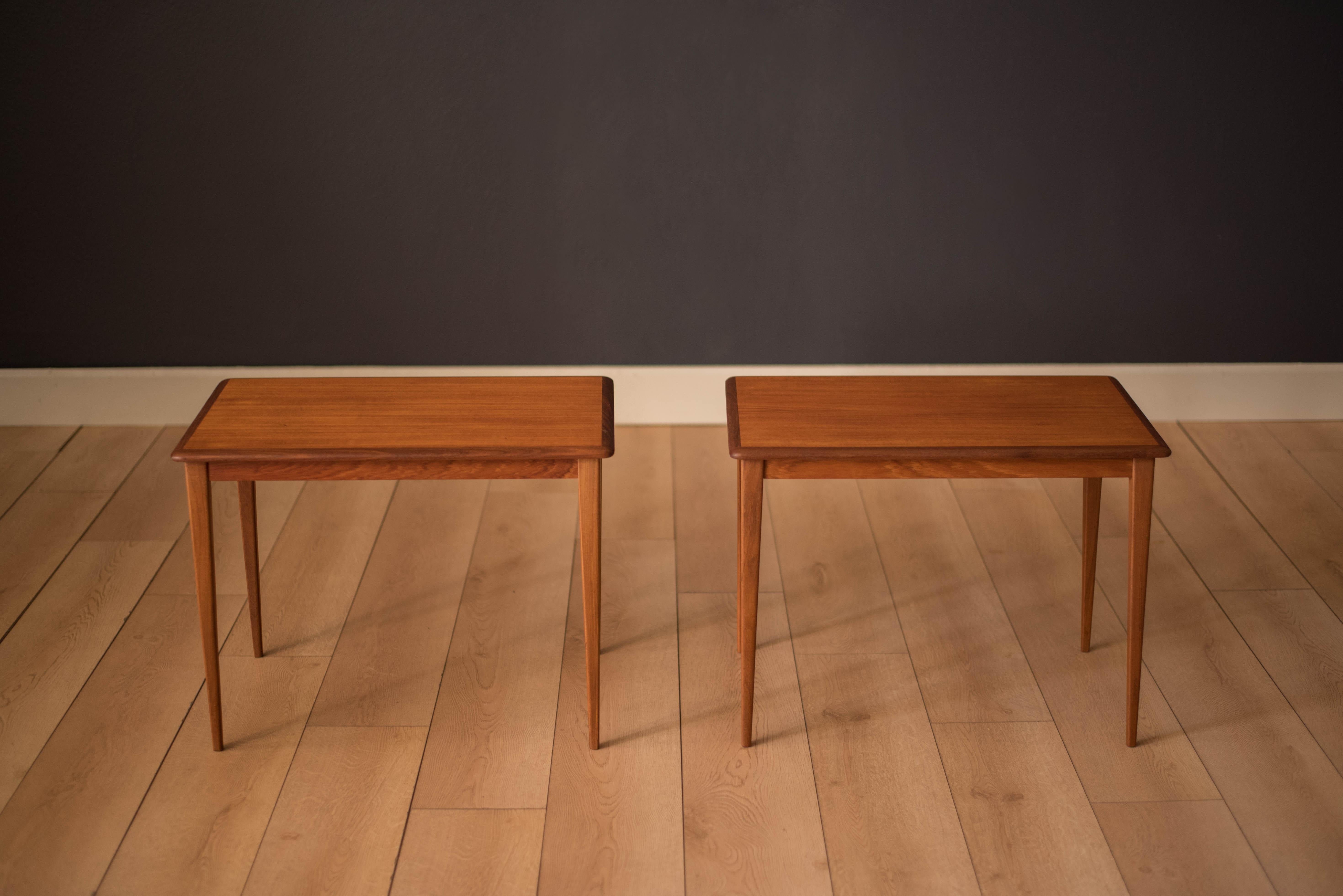 Vintage pair of side tables made in Sweden, circa 1960s. This set features tapered angled legs and teak table tops with contrasting solid afromasia edges.


Offered by Mid Century Maddist