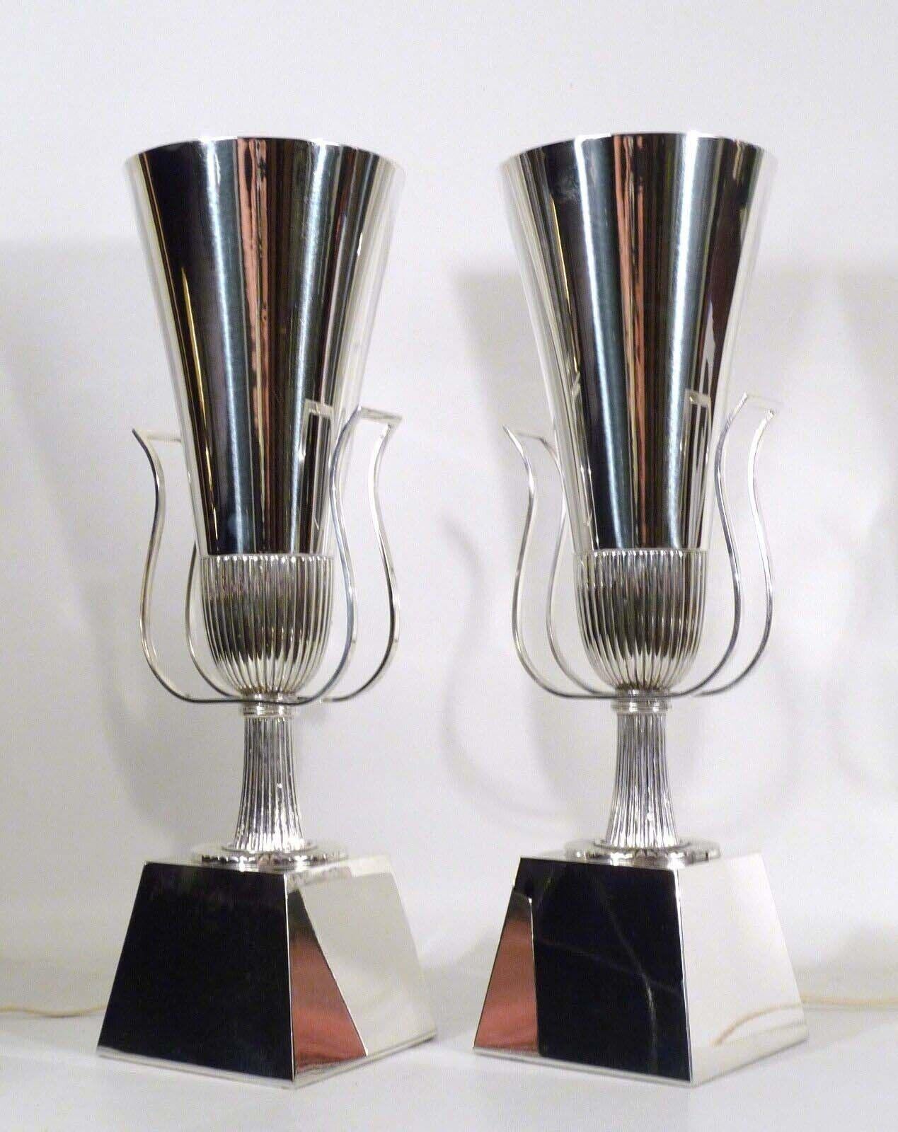 For your consideration is this rare pair (2) of silver plated brass torchiere up lights by Tommi Parzinger from Lightolier's Heritage Silver Collection dating from the 1940s. Listing is for the pair, a single unit is not available. In pristine