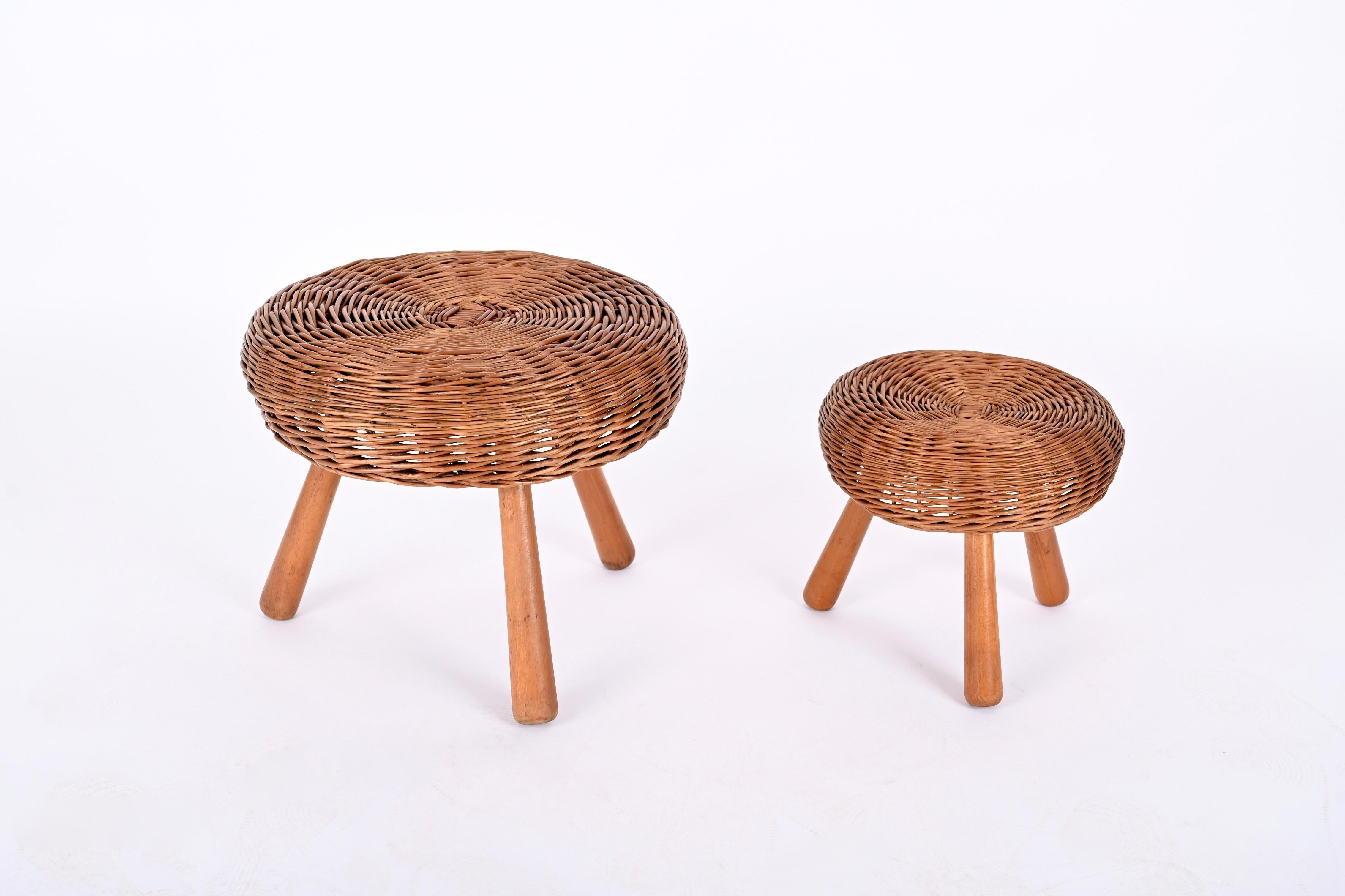 Rare pair of Tony Paul wicker stools, made in the USA in the 1950s.

This iconic and sturdy stools feature a beautful hand woven rattan mix while sitting on three solid beech wood legs, giving the stool wonderful proportions. The center of the