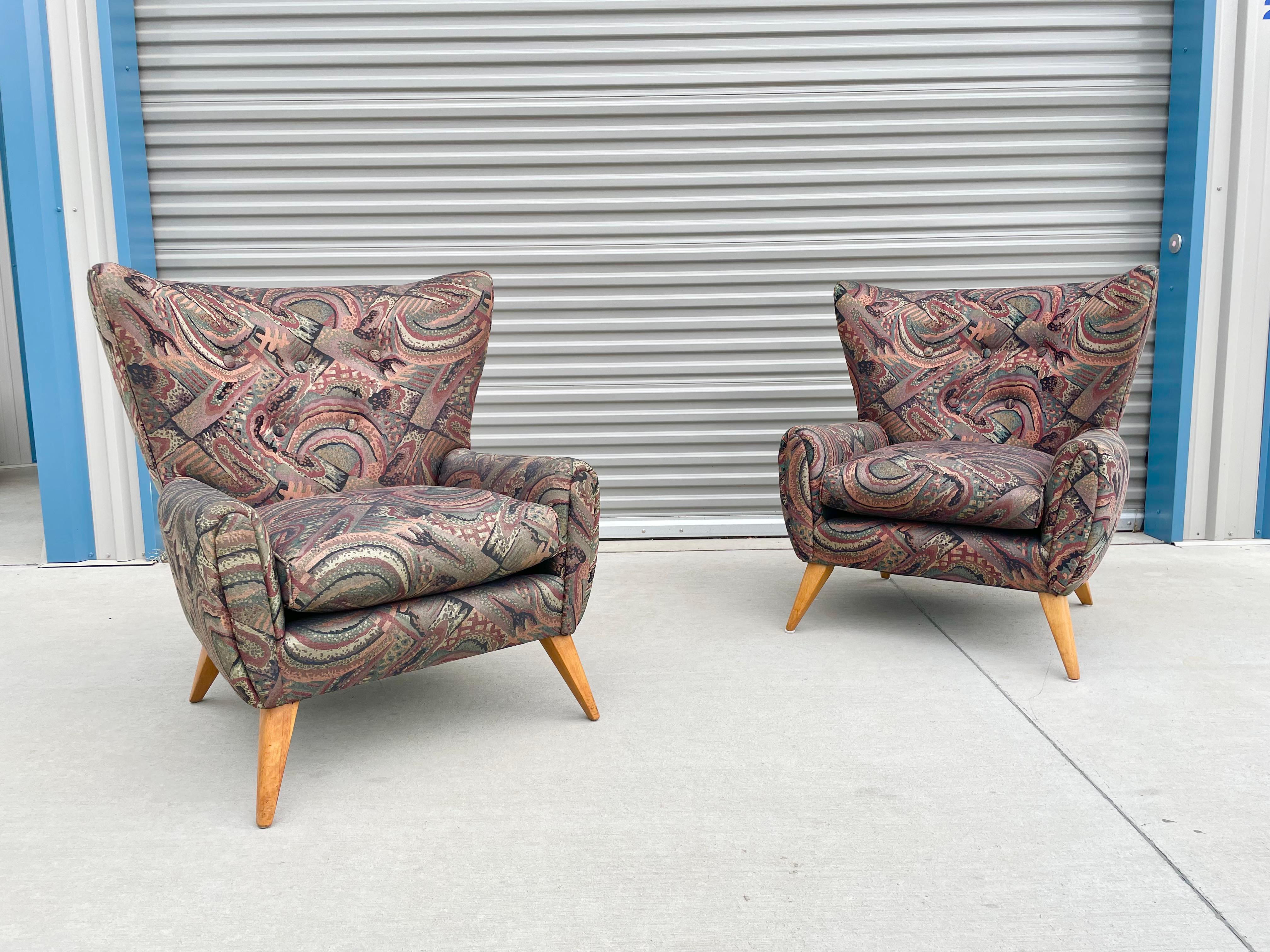 Pair of midcentury wingback lounge chairs designed and manufactured in the United States circa 1960s. These beautiful vintage chairs feature a lovely wingback design that offers excellent lumbar support giving a great comfort experience. The chair