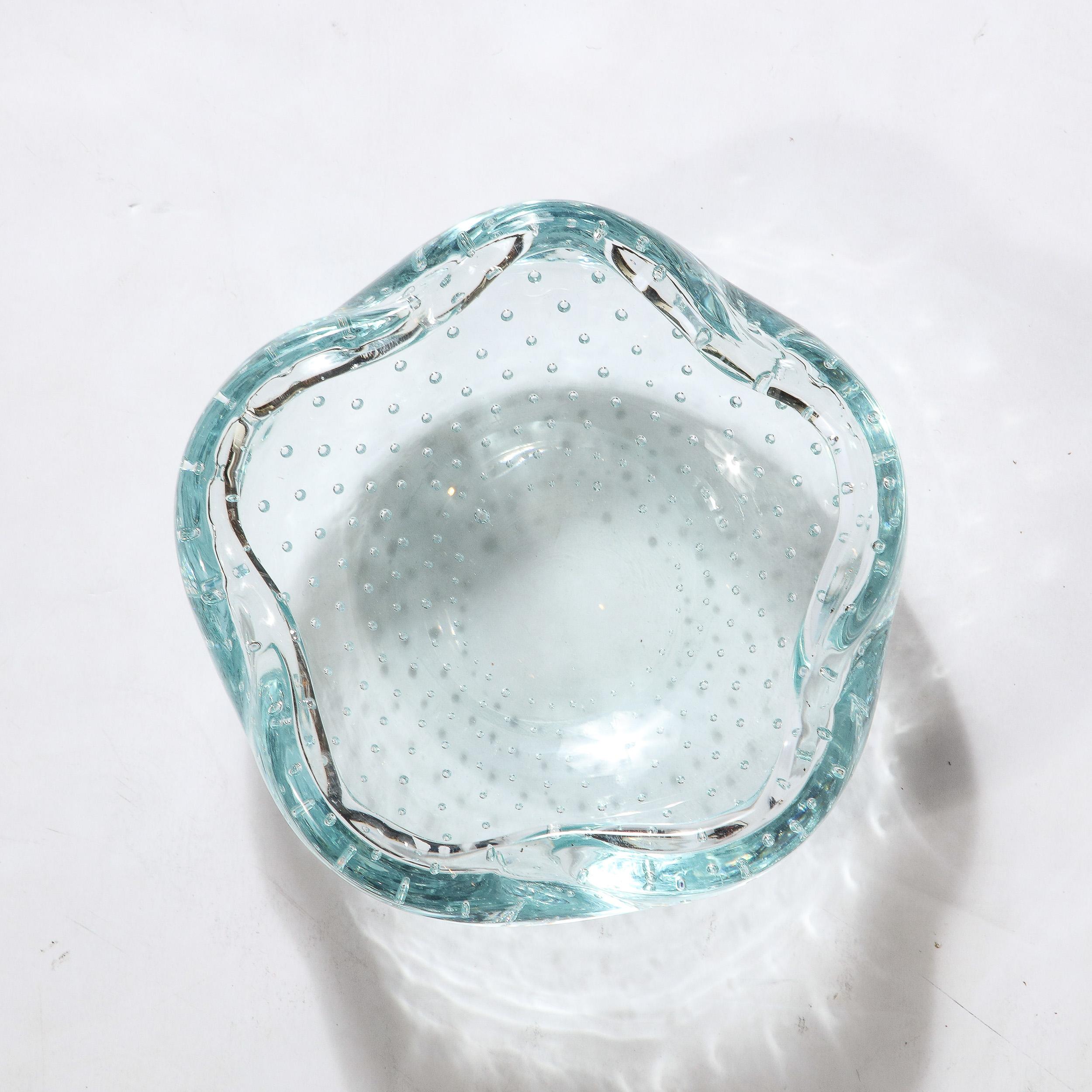 This stunning Mid-Century Modernist Pale Blue Hand-Blown Glass Dish with Bullicante Detailing signed Daum originates from France, Circa 1960. Daum, founded in 1878 by Jean Daum has been known since it's conception and to this day for producing