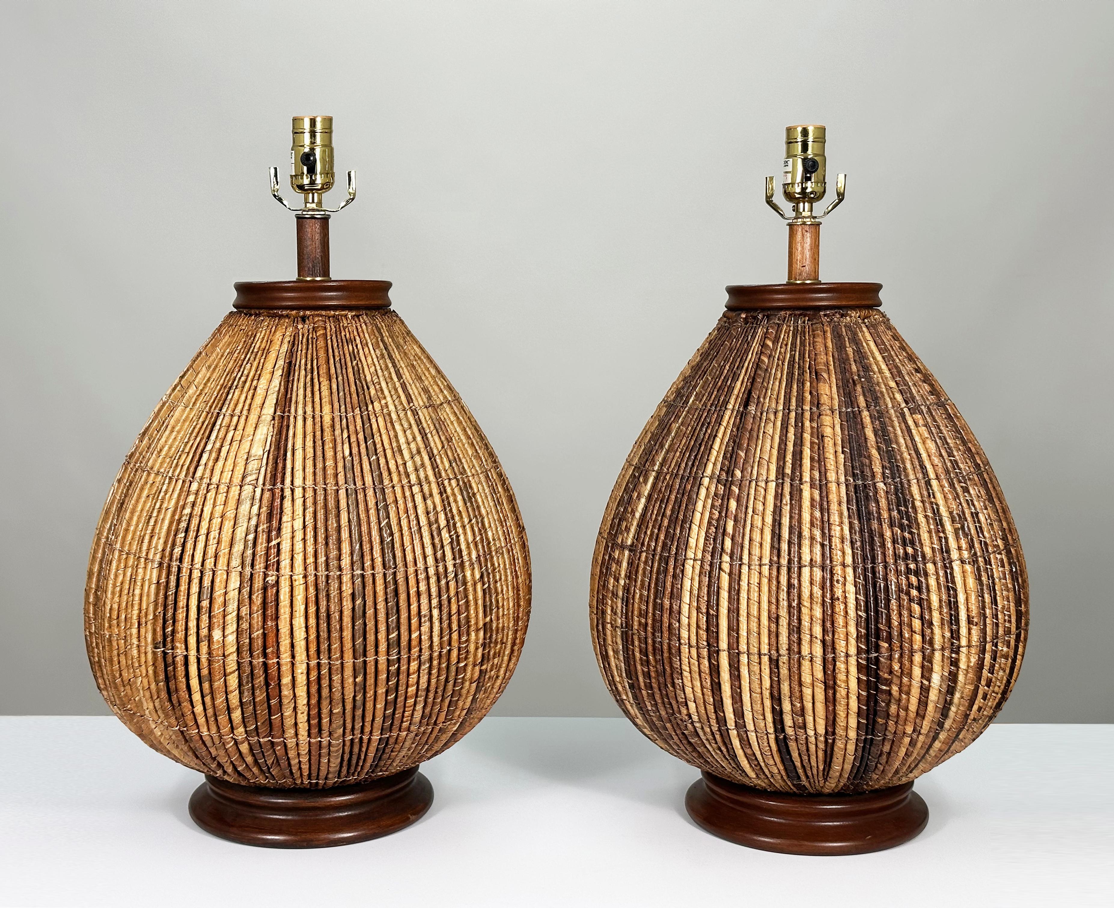 Exquisite early examples of Allan Palacek’s handcrafted rattan basketweave designs with high-contrast textural appeal, first introduced to the U.S. in San Francisco in 1974. 

After six years of piloting missions in Southeast Asia during the Vietnam