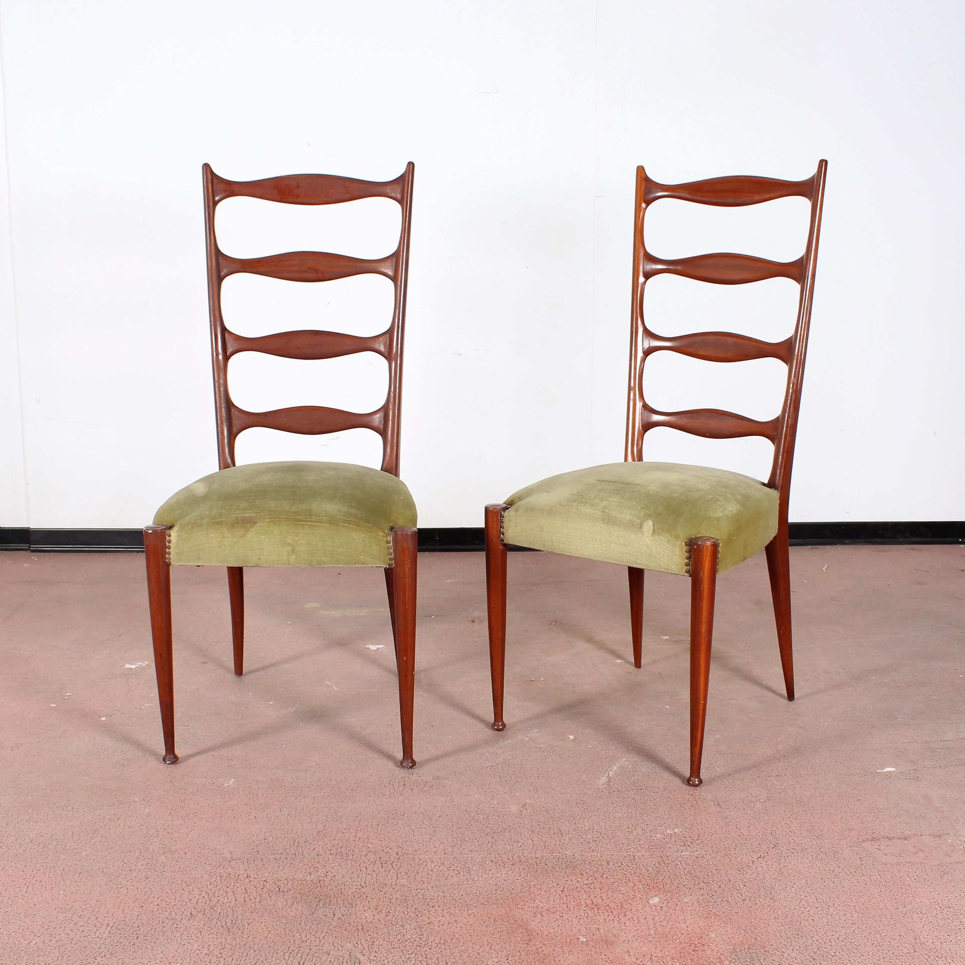 Set of four dining chairs with wooden structure, green velvet covering, and spiked legs. Paolo Buffa style, Italian manufacture in 1950s.
Wear consistent with age and use.
 