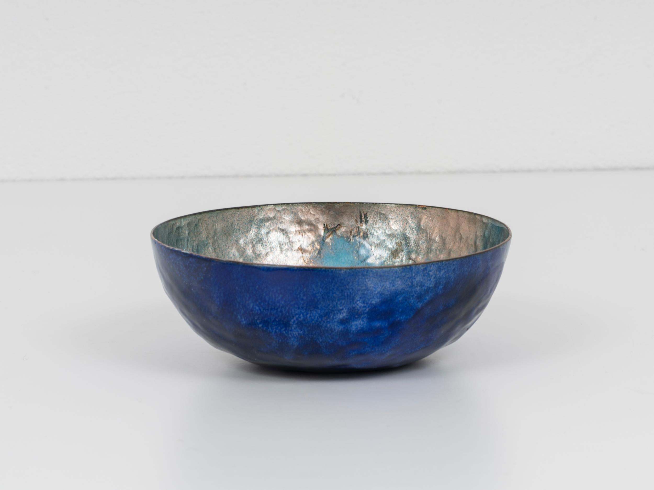 This bowl was designed and executed by Paolo De Poli for his own manufacturer in c. 1960. As all his reknown pieces, it is made of embossed enameled copper, it is signed under the base and bears some torn remains of the label 