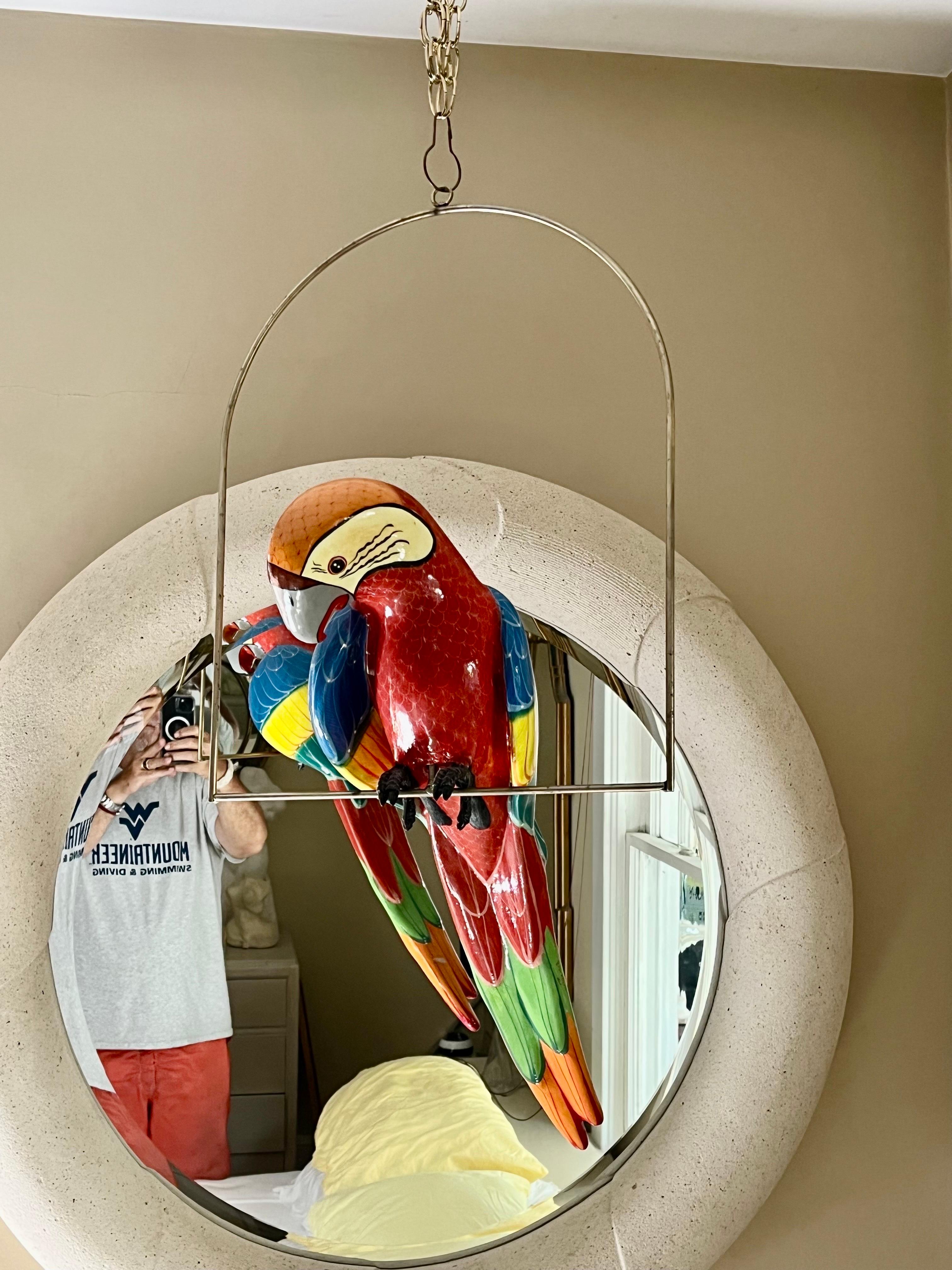 paper mache parrot on hanging perch