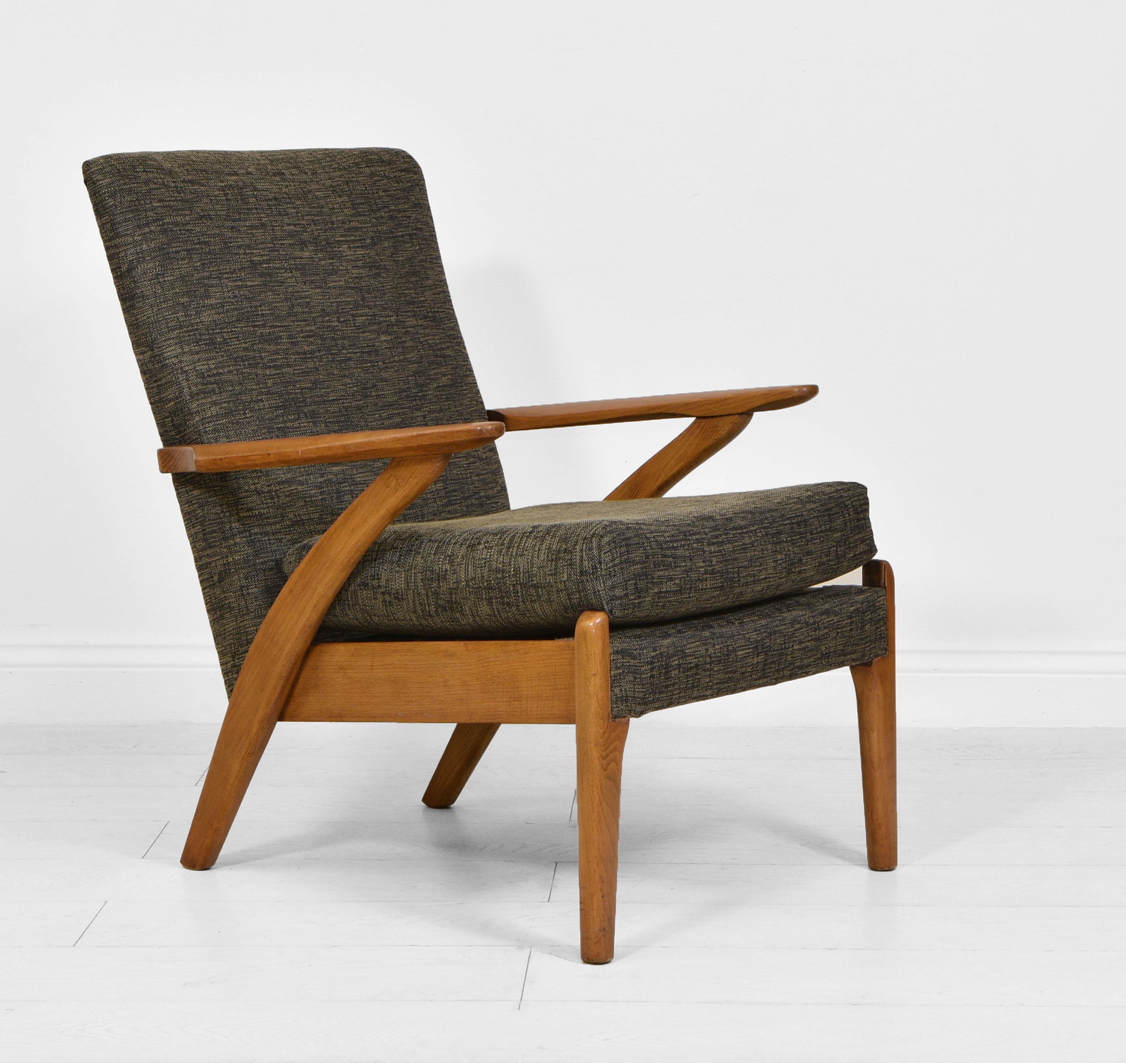 A stylish mid-century armchair made by Parker Knoll. Circa 1950. Sought after design 900/6

The armchair has been recently reupholstered, along with a new foam cushion.

Very sturdy with no loose joints or damage. There are some light marks to