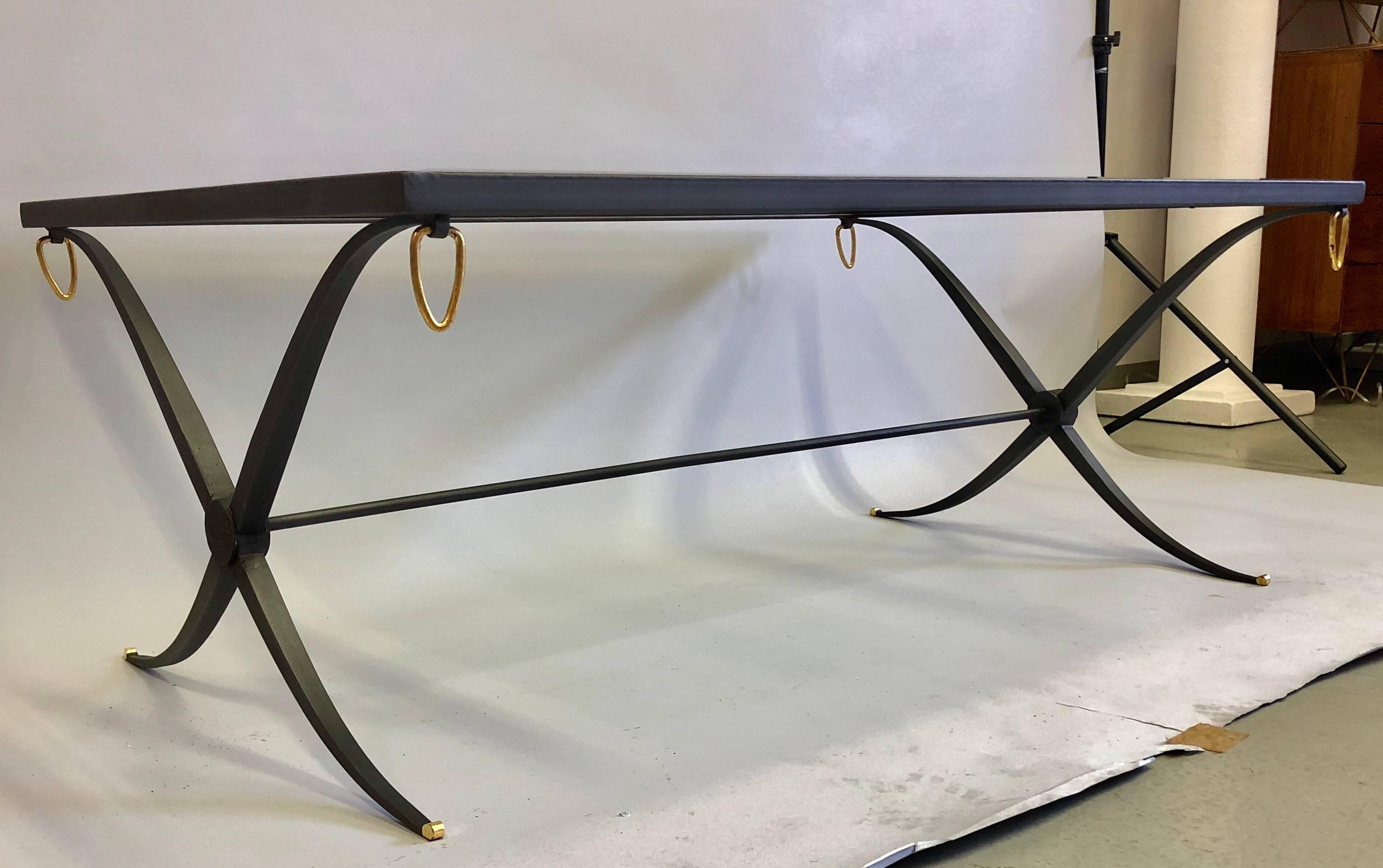 Elegant French Mid-Century Modern Neoclassical wrought iron cocktail table attributed to Raymond Subes. The piece presents a pure form in classic styling that bridges modernism and classicism with a trend setting, minimal aesthetic.  The table has a