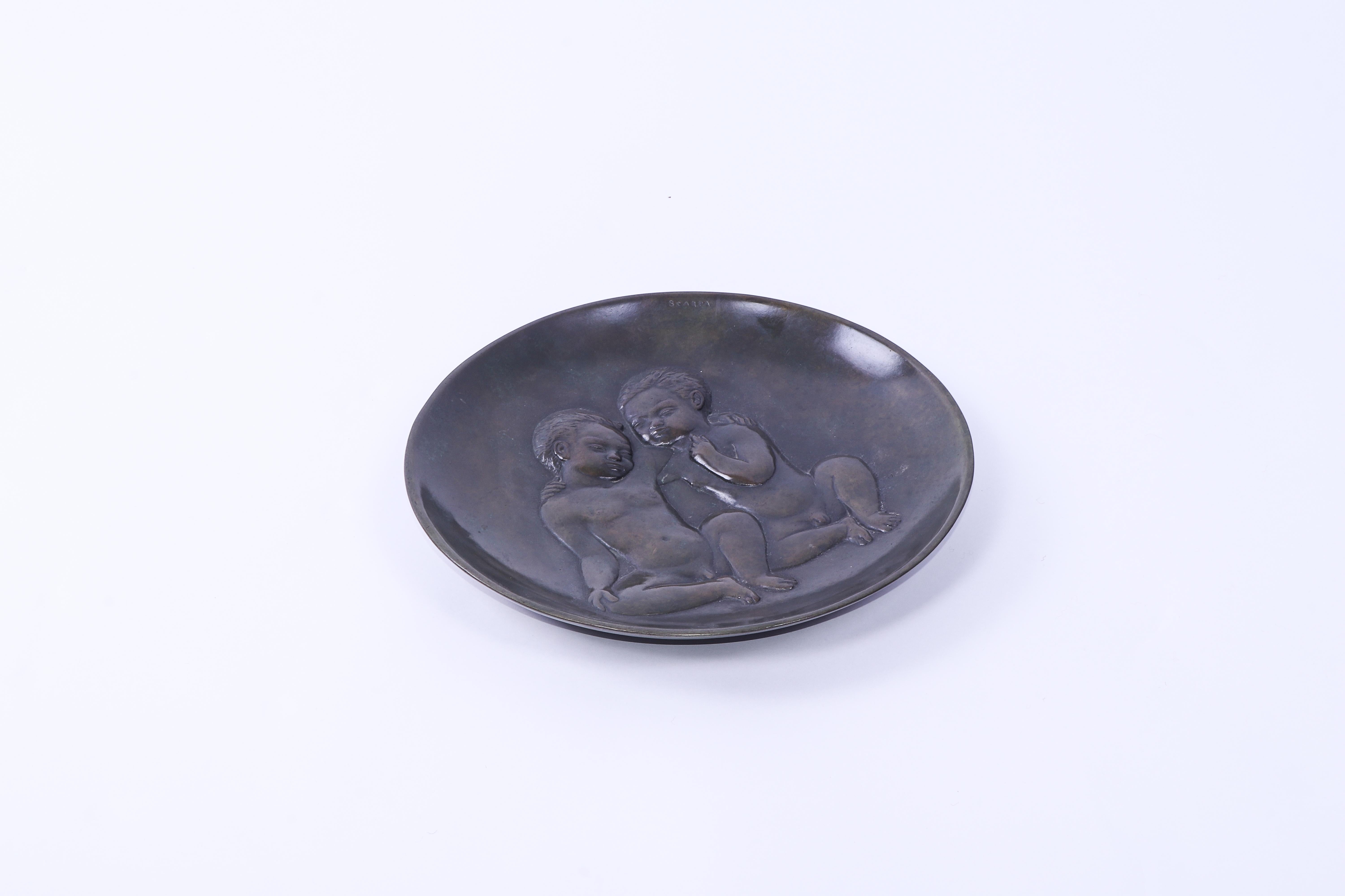 Patinated bronze bowl by Italian sculpture and designer Riccardo Scarpa. Originally heralding from Venice, Italy, Riccardo Scarpa later settled in France. 

This bowl is typical of his patinated bronze work from the same period. 

The iconography of