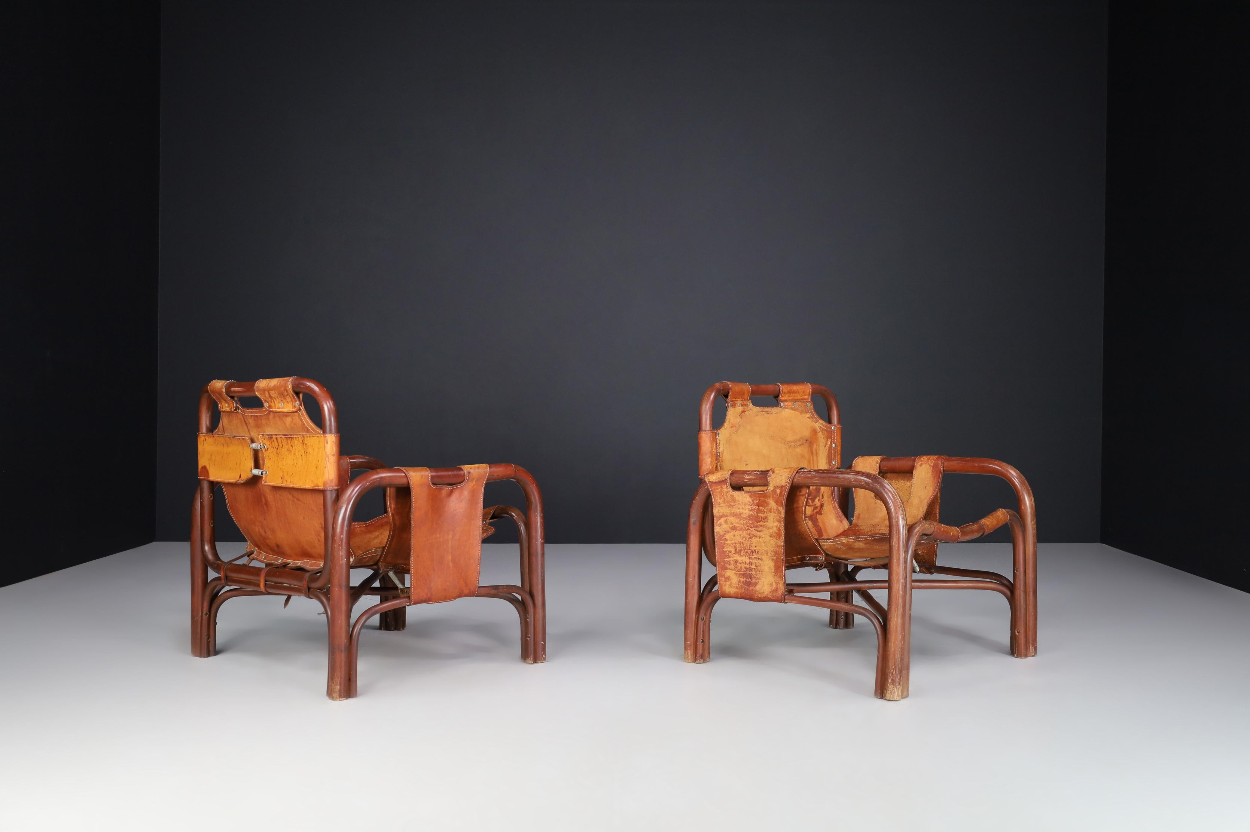 Italian Mid-Century Patinated Leather and Rattan Lounge Chairs by Tito Agnoli Italy 1960 For Sale