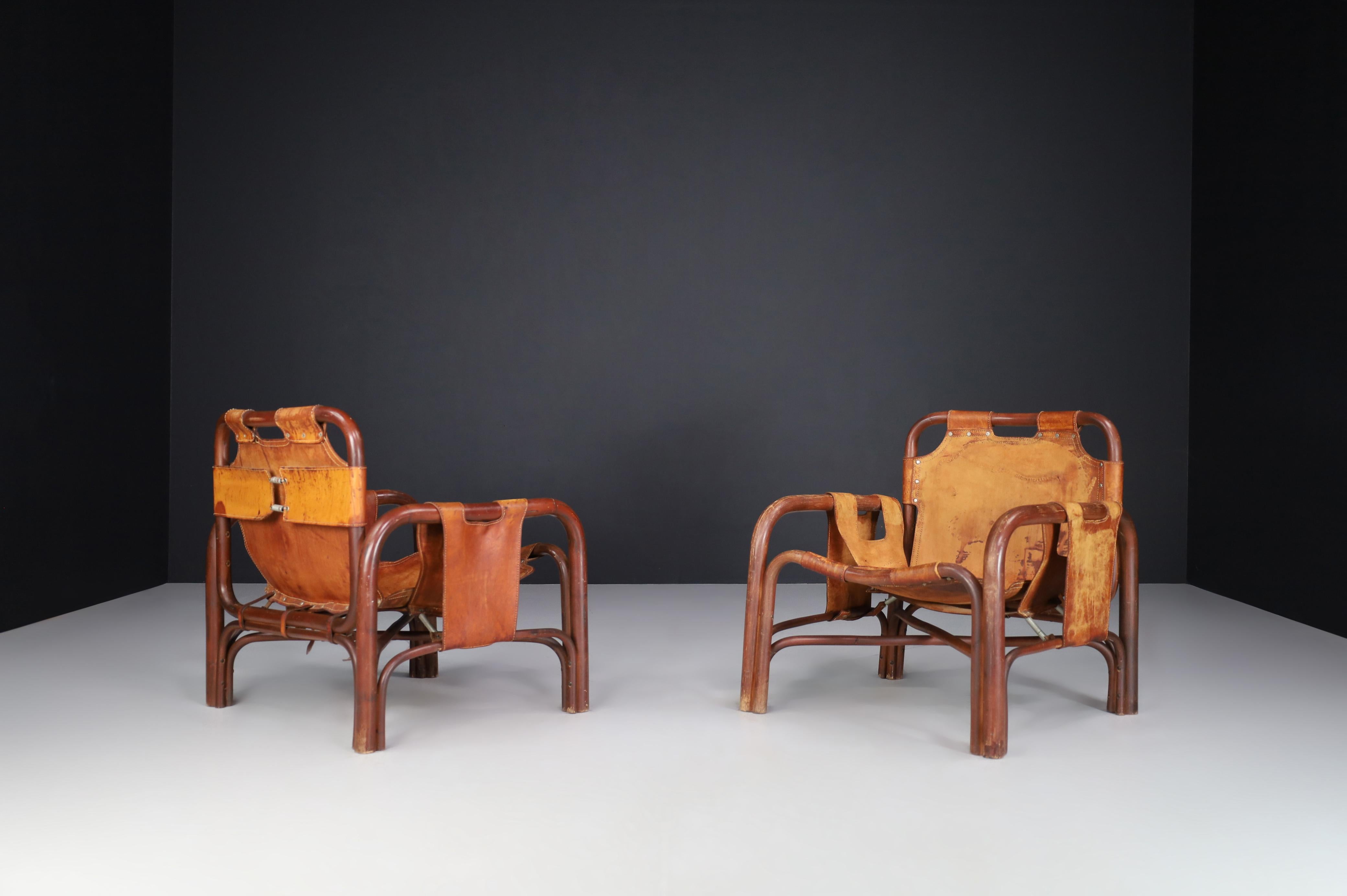 Mid-Century Patinated Leather and Rattan Lounge Chairs by Tito Agnoli Italy 1960 In Good Condition For Sale In Almelo, NL