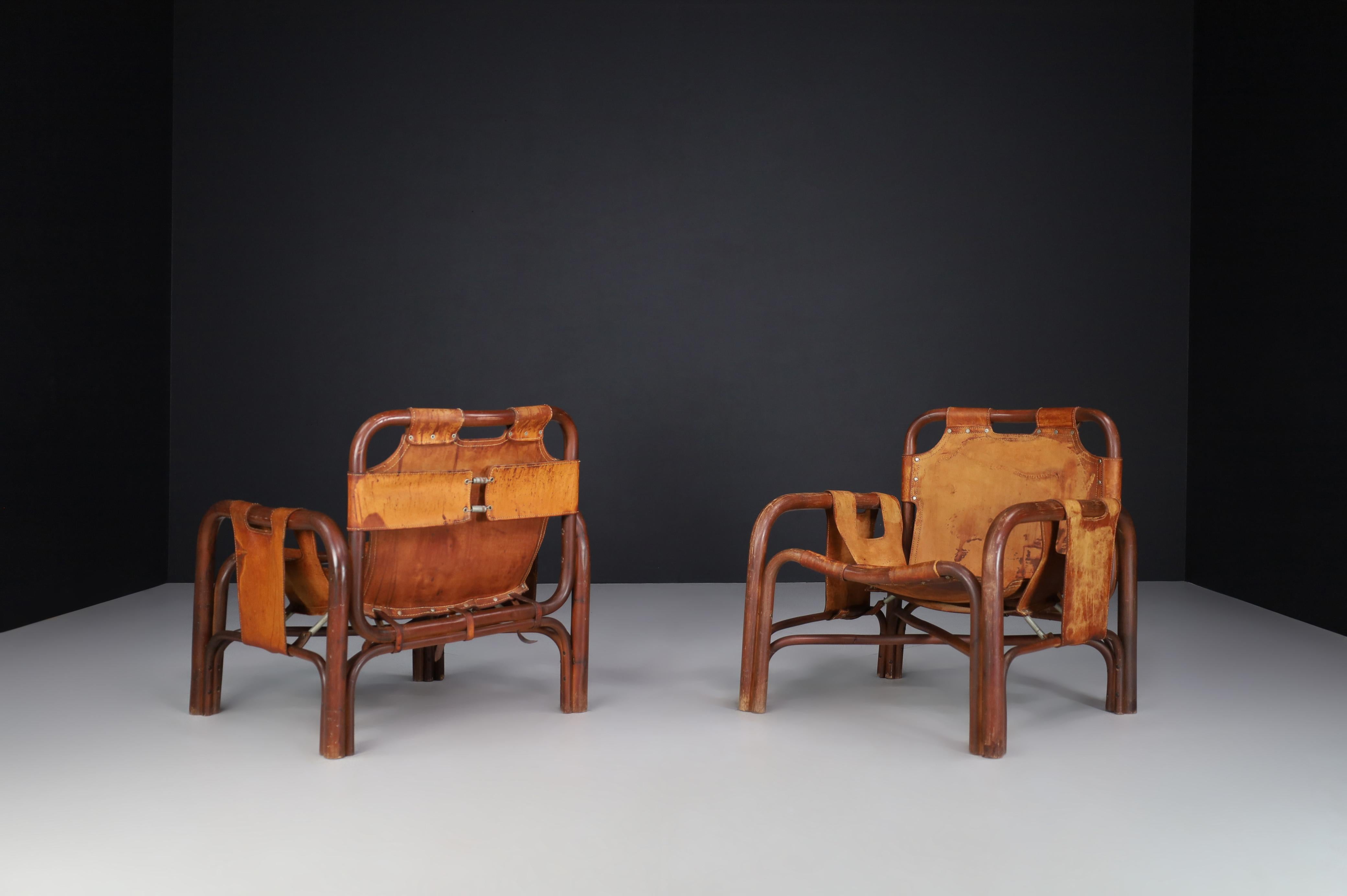 20th Century Mid-Century Patinated Leather and Rattan Lounge Chairs by Tito Agnoli Italy 1960 For Sale