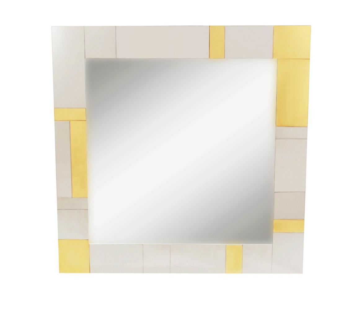 An incredible design combination, a cityscape wall shelf and mirror designed by Paul Evans in the 1970's. The set features fine heavy construction with brass & chrome clad patchwork design. Includes two L shaped wall brackets, wall mirror, and heavy