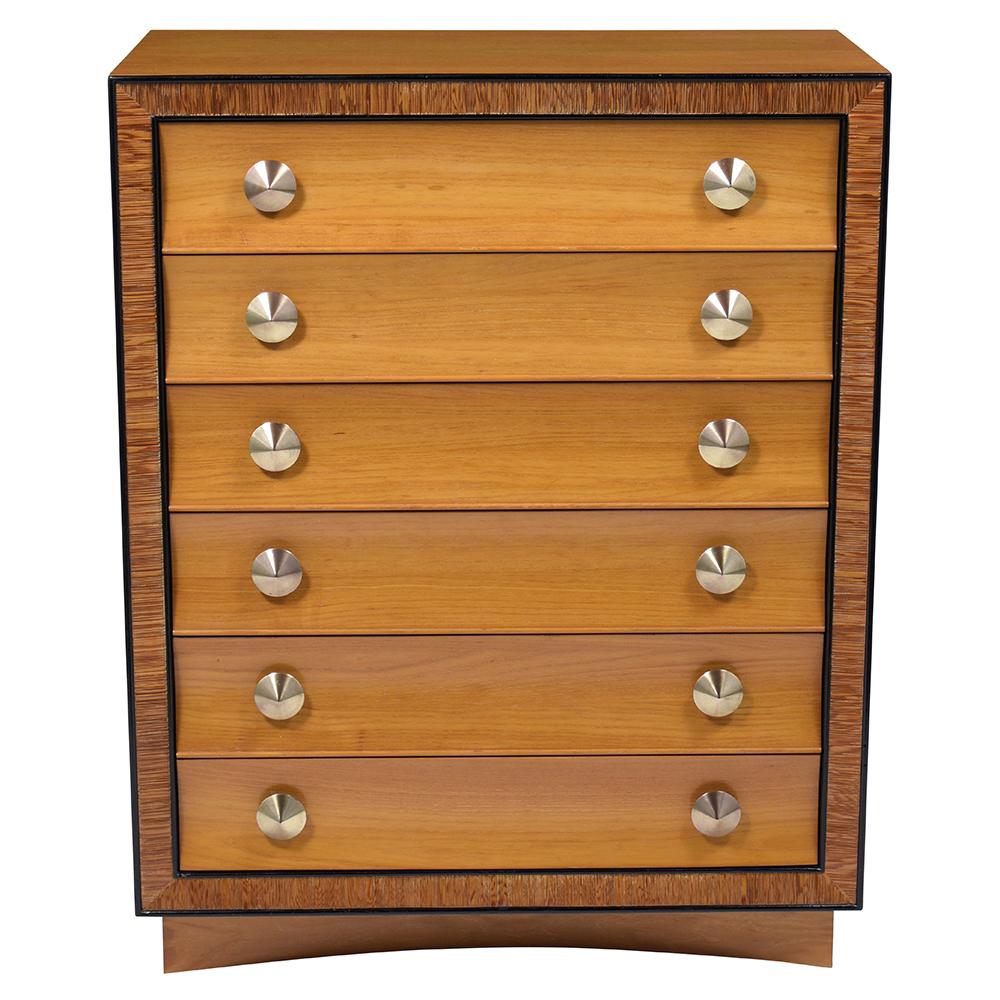 This fabulous Mid Century Chest of Drawers by Paul Frankl for Brown Saltman is handcrafted out of birch wood and features a light walnut & ebonized color combination with a newly lacquered finish. The chest comes with six drawers each with two
