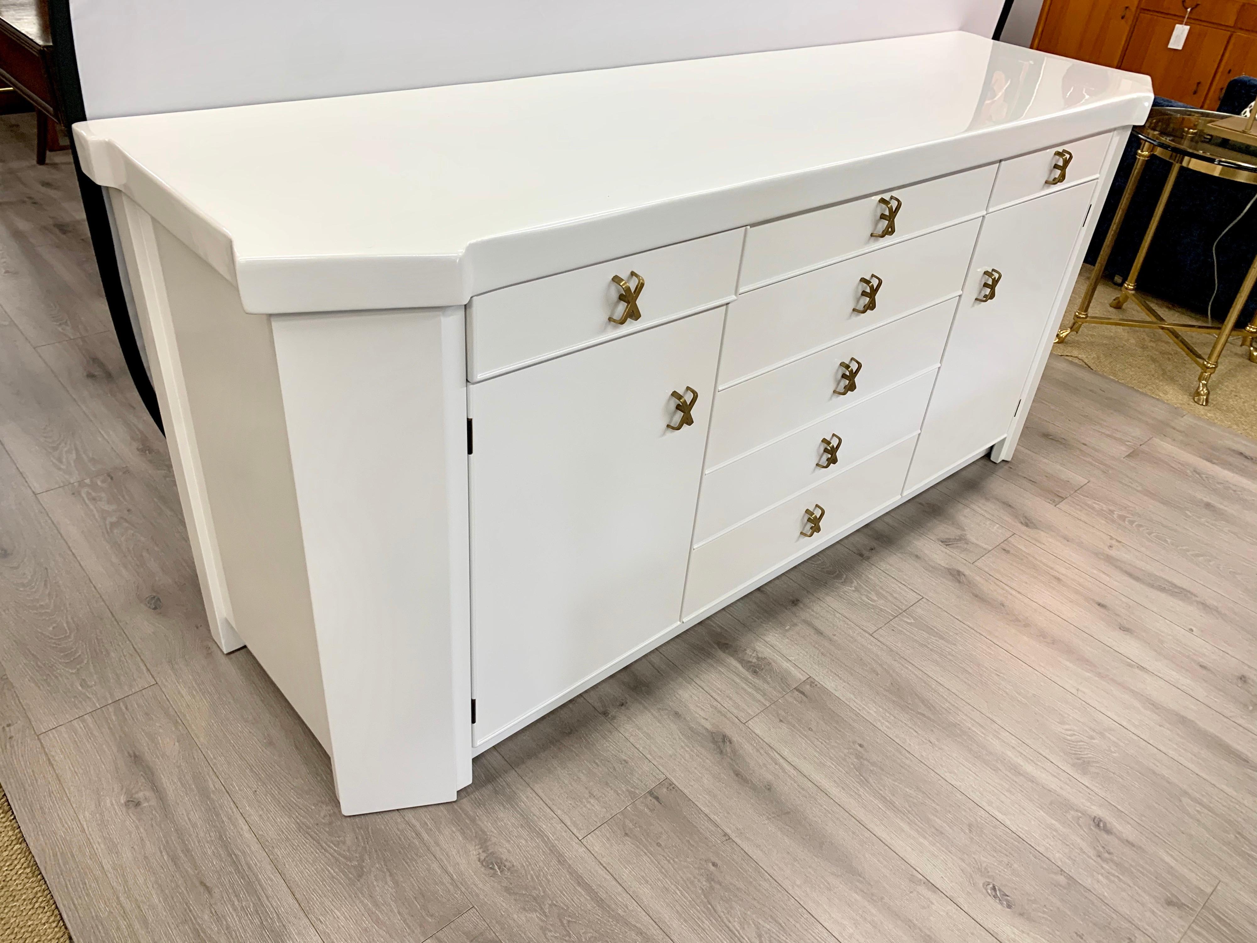 Magnificent, newly lacquered brilliant white lacquered multi purpose cabinet. All original, except the lacquer. Features the coveted X pulls. Now more than ever, home is where the heart is.