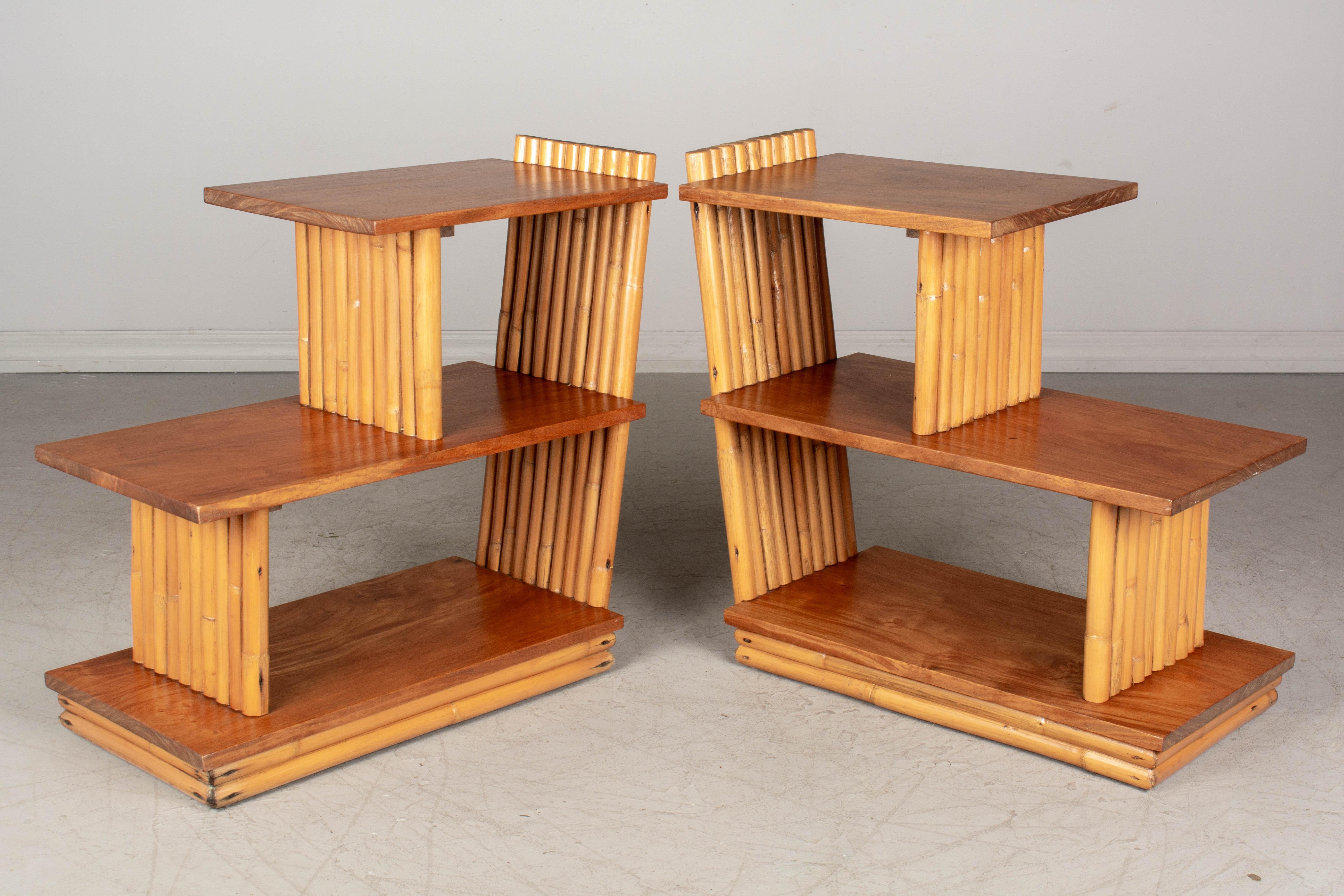 A pair of Mid-Century Modern Paul Frankl stepped end tables made of rattan and mahogany. Please refer to photos for more details.   

 