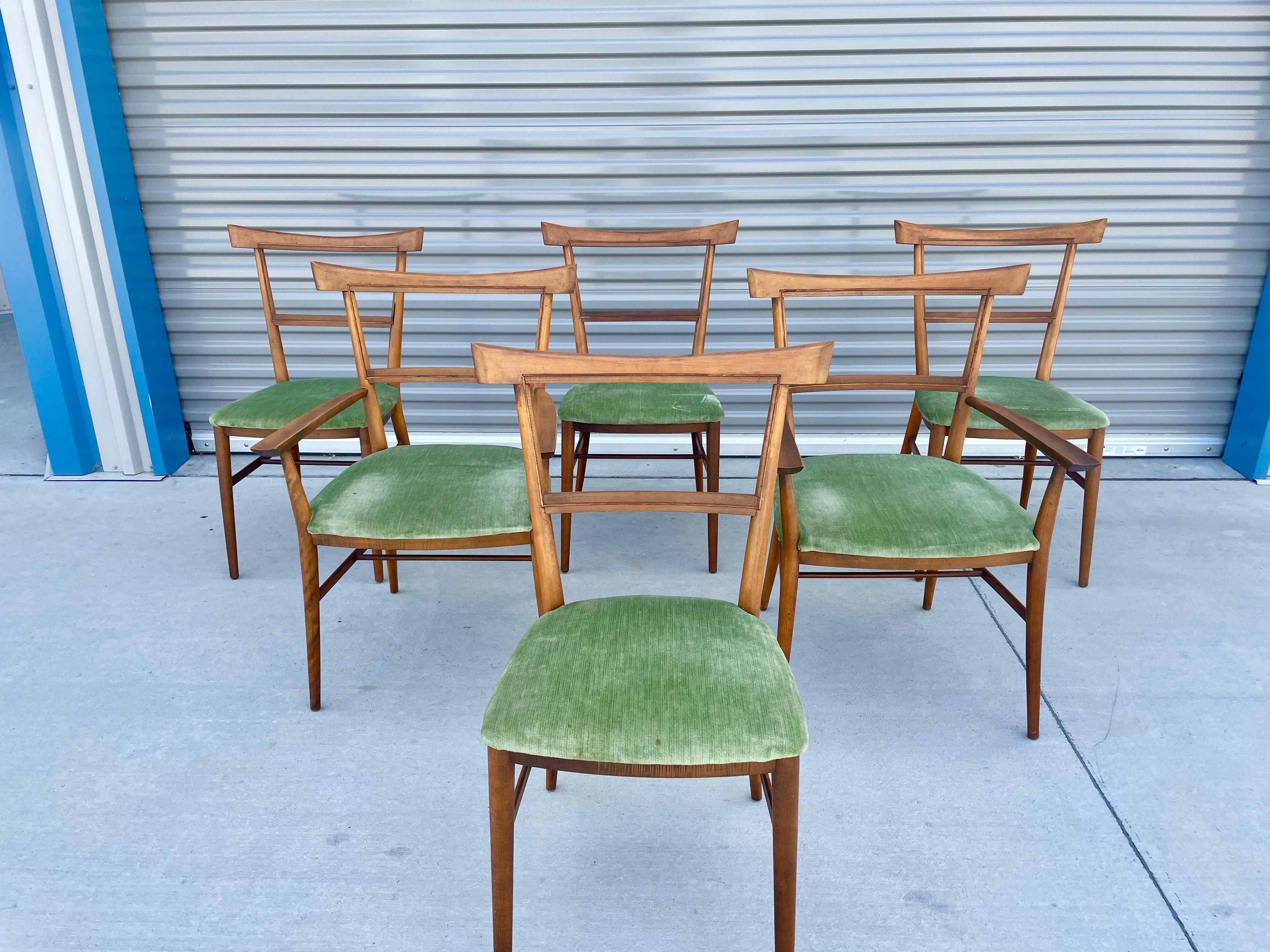 Midcentury set of eight dining chairs by Paul McCobb for Winchendon. This beautiful set of eight dining chairs features a stunning maple frame. The chairs are missing the back cushion, but it can be easily remade when you have them upholstered.