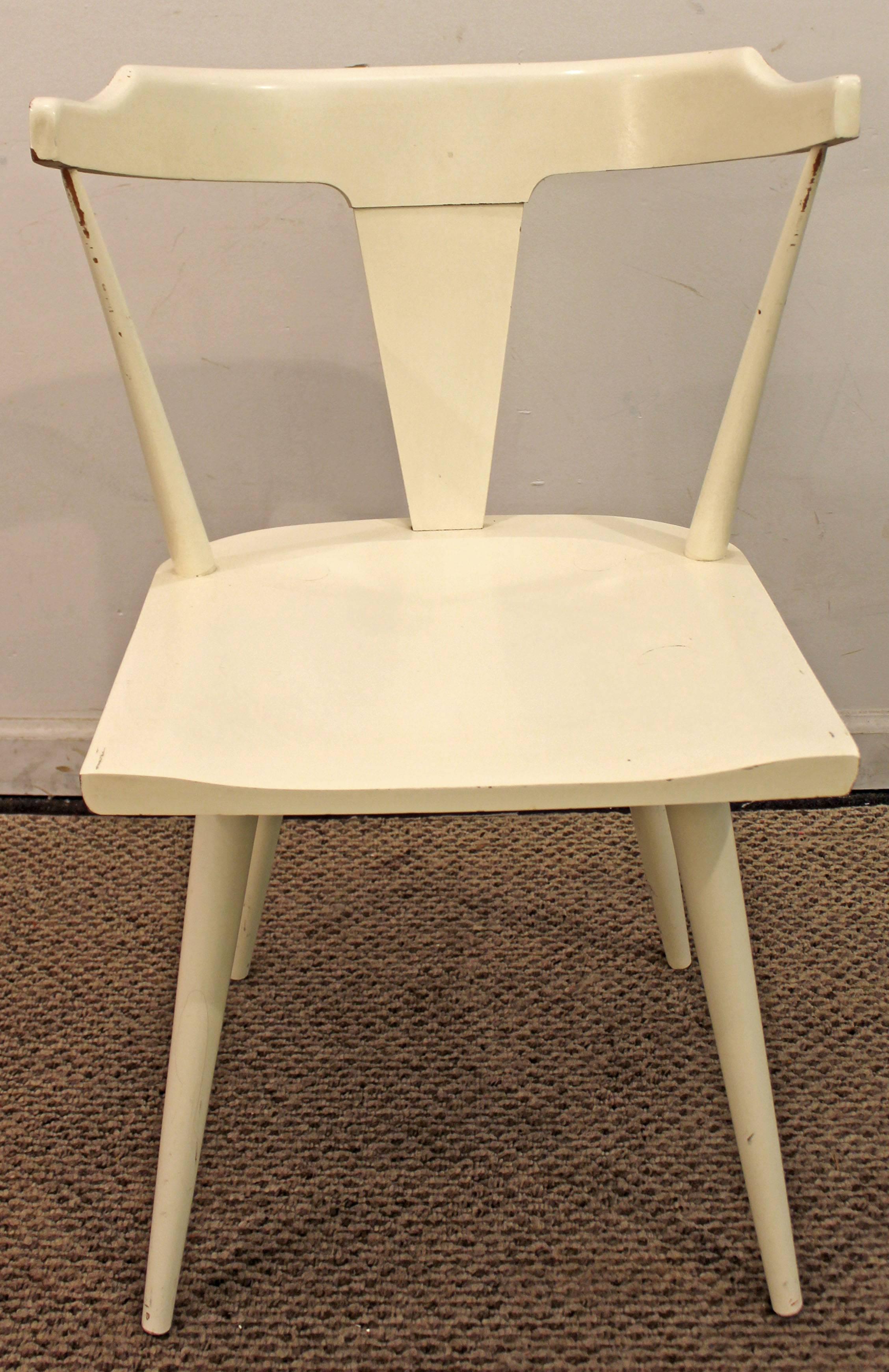 Offered is a chair designed by Paul McCobb for Planner Group by Winchendon. It has been painted white by the previous owner. See our other listings for a matching headboard, credenza, and dresser!

Measures: Seat height 17.25
