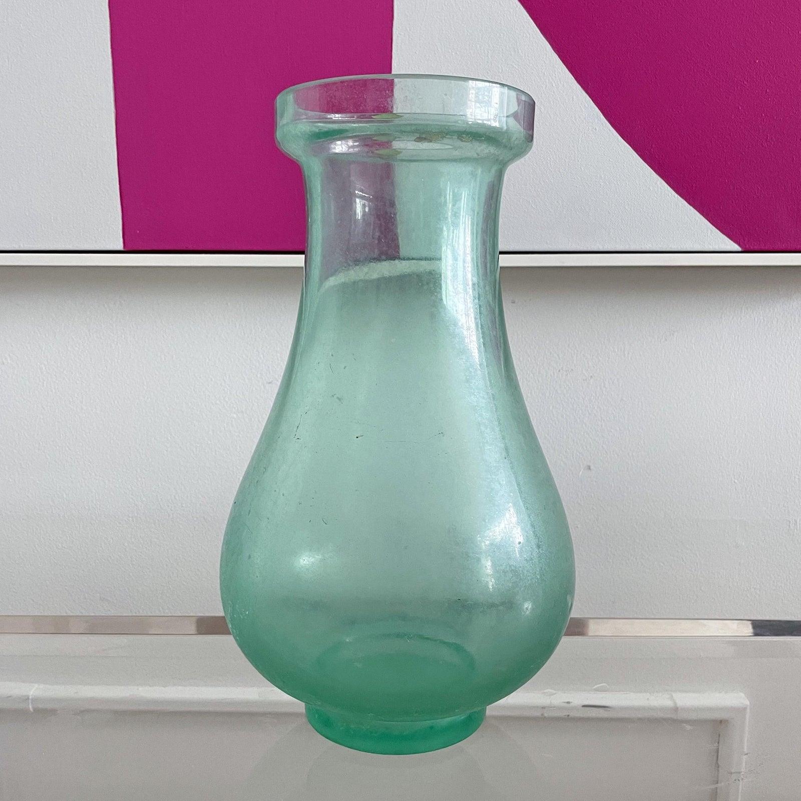 Bulbous Seguso vase in the scavo technique rendered in a subtile shade of green. Intact label dating the piece 1960-1970.