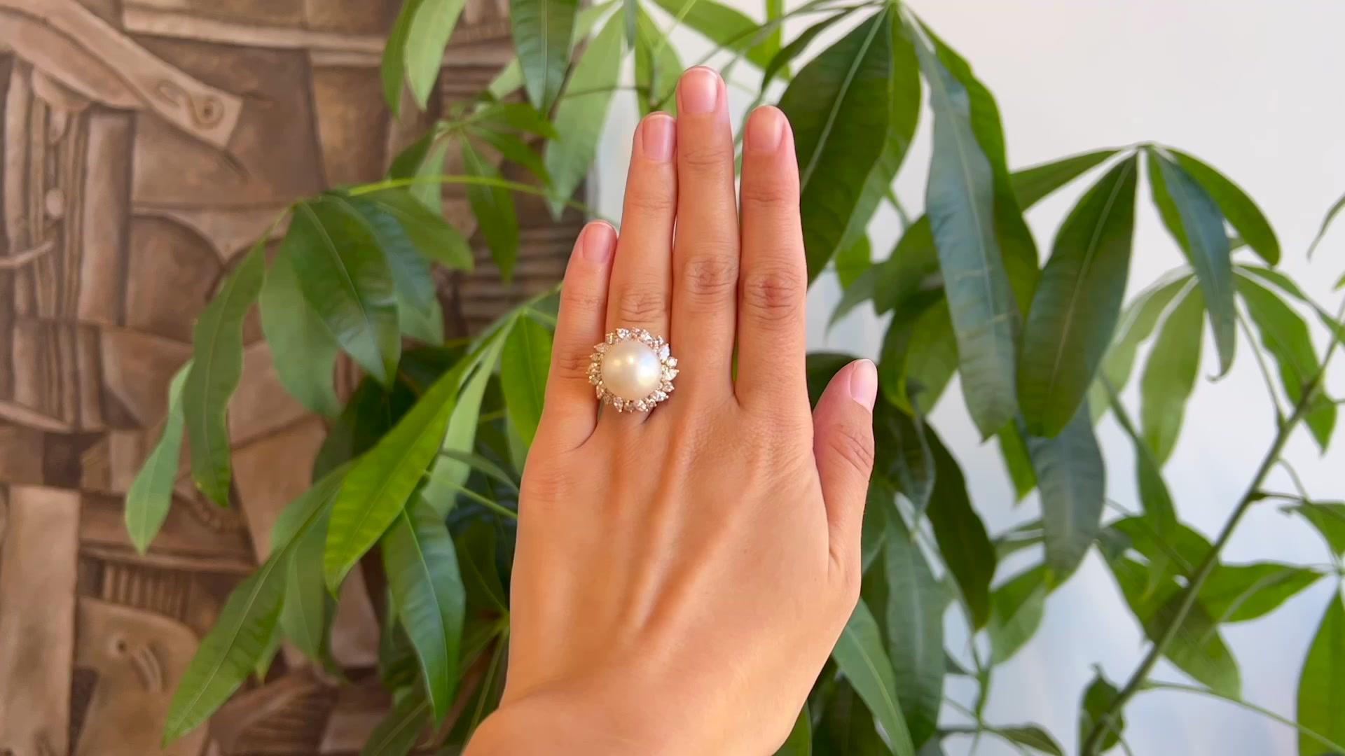 One Mid Century Pearl Diamond 18 Karat Yellow Gold Cocktail Ring. Featuring one pearl. Accented by 10 marquise cut diamonds with a total weight of approximately 0.95 carat, graded near-colorless, VS-SI clarity, and 20 round brilliant cut diamonds