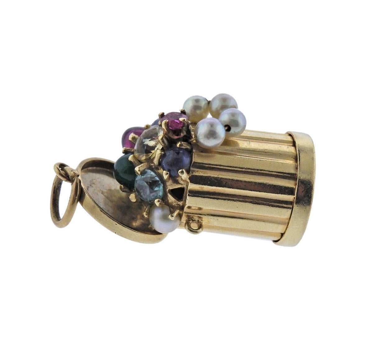 14k gold mid century charm featuring pearls, ruby, sapphire and emeralds. Charm measures 35mm X 18mm and weighs 16.4 grams. Marked 14k, 