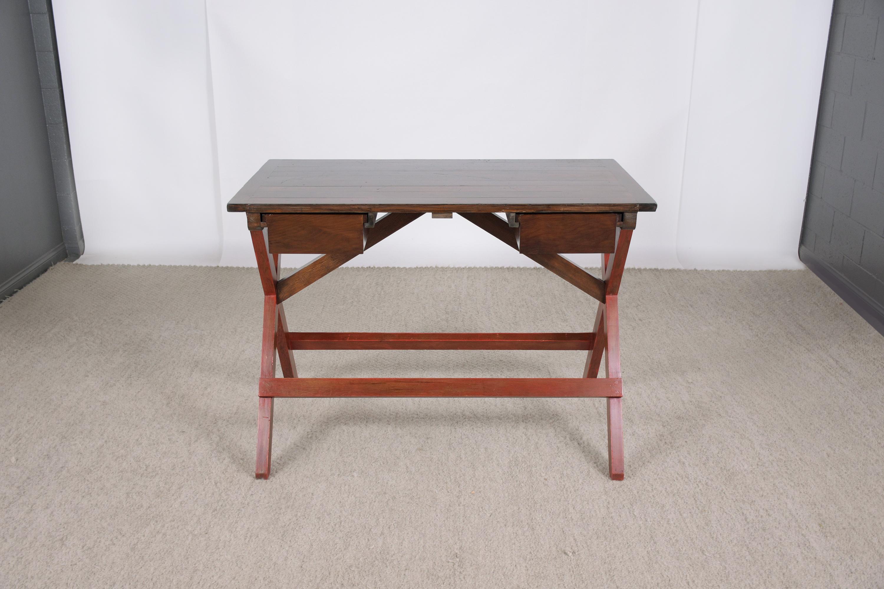An extraordinary mid-century pine desk in good condition beautiful hand-crafted out of solid pitch pine wood newly restored by our team of expert craftsmen. This 1950s desk features a rectangular wood slab top with wear & use from age, is newly