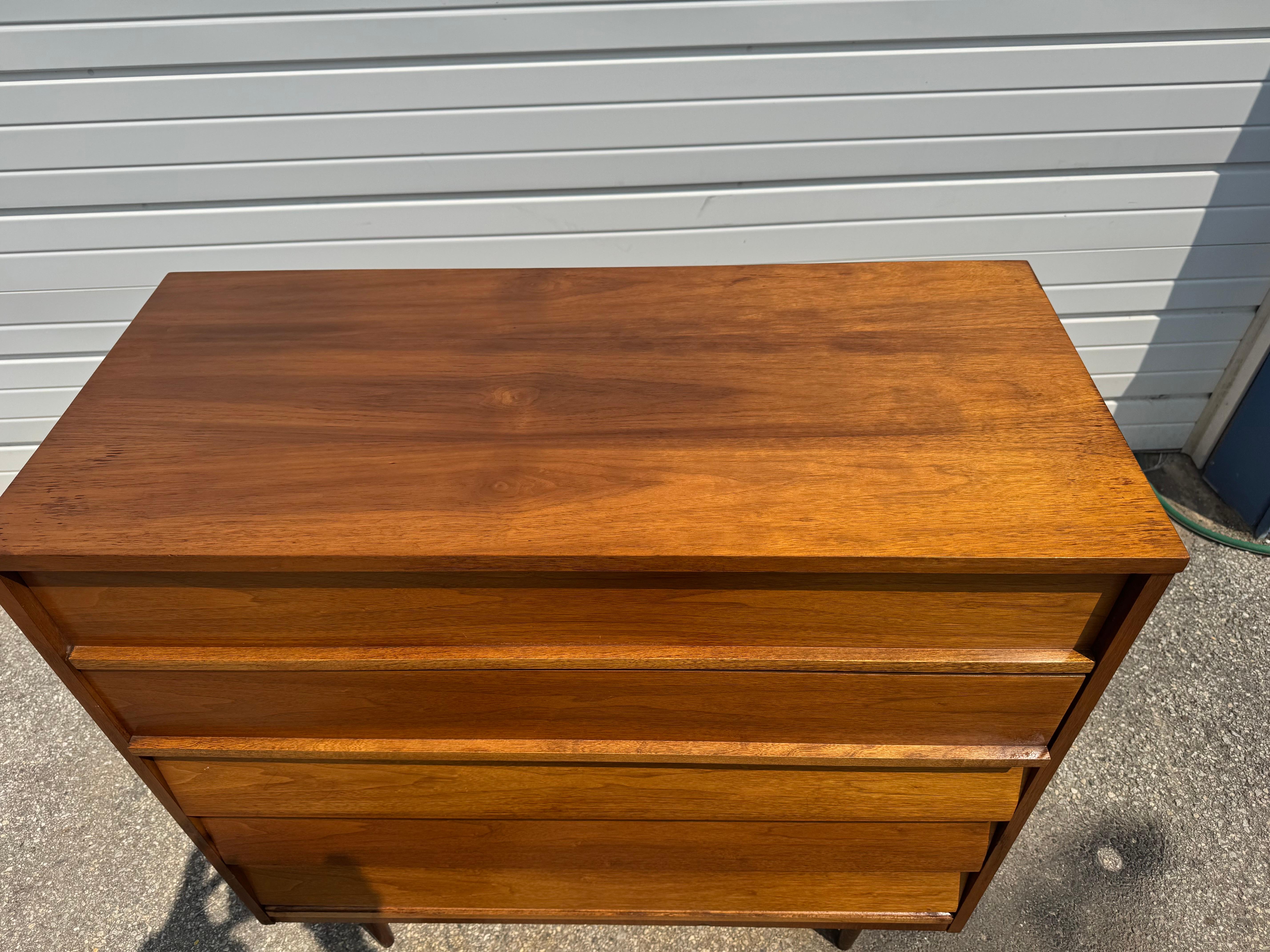 Mid-Century Pencil Leg Tall Dresser/Chest by Dixie

Offered is a walnut tall chest of drawers made by Dixie. This piece is quite versitile and lends itself to any space or design project. Elevated on lovely pencil legs and featuring louvre front