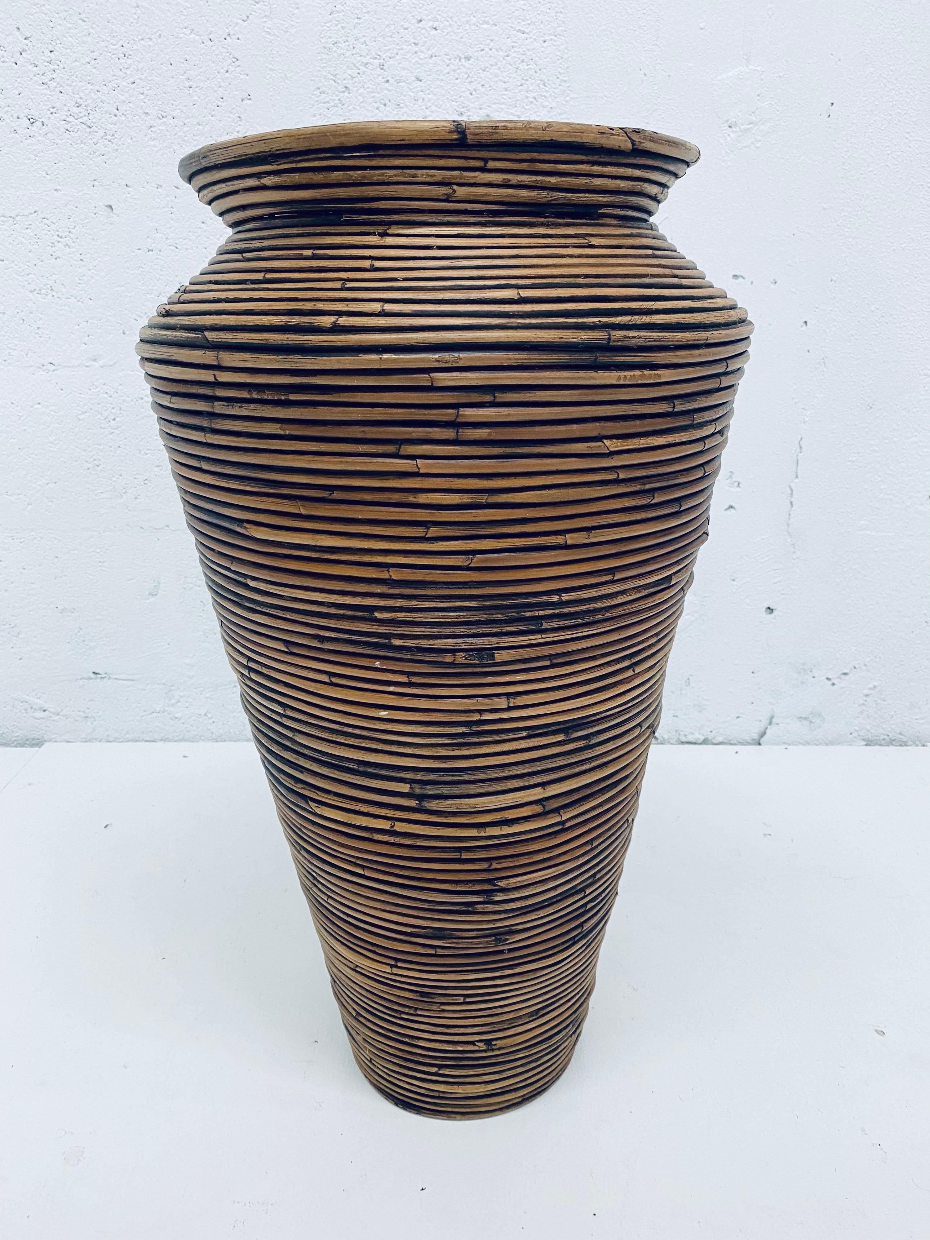 Handcrafted midcentury floor vase made from pencil reed.