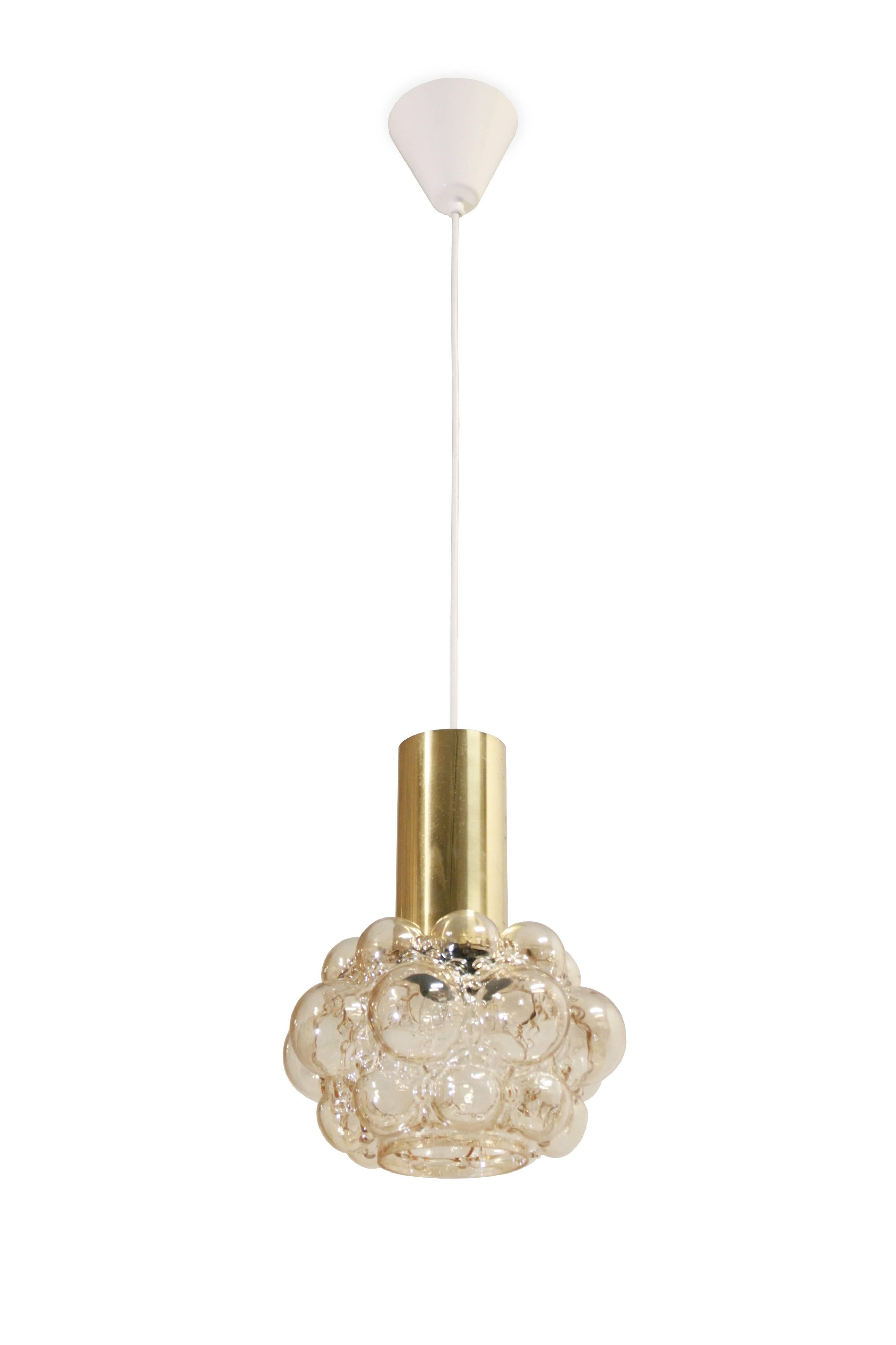 Decorative ceiling lamp in brass and handblown glass. Designed by Helena Tynell for Limburg, Germany from 1970s second half. The lamp is fully working and in good vintage condition.