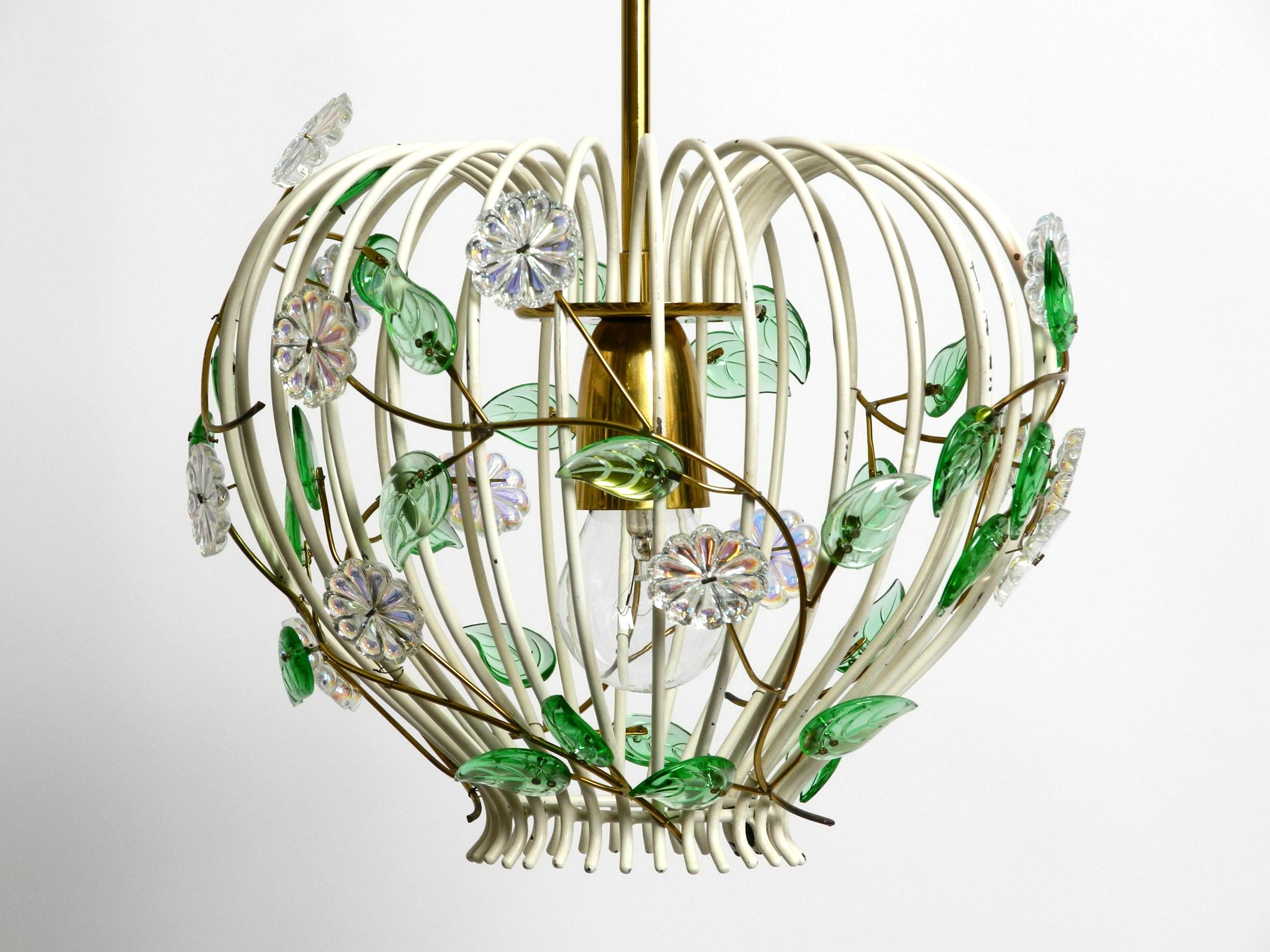 Extraordinary mid century pendant lamp with metal grid and glass stones by Vereinigten Werkstätten.
Metal frame with green and transparent stones on brass branches. Great classy 1950s design.
100% original condition with original paint. All parts