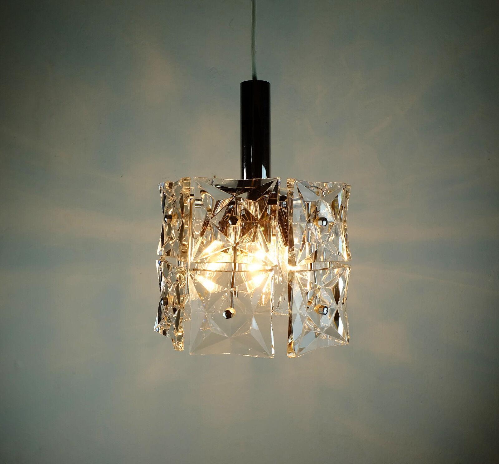 Very beautiful pendant lamp manufactured in the 1960s by Kinkeldey. Made of chrome plated metal and crystal glass. The shade consists of 14 glass prisms made of faceted crystal glass (4