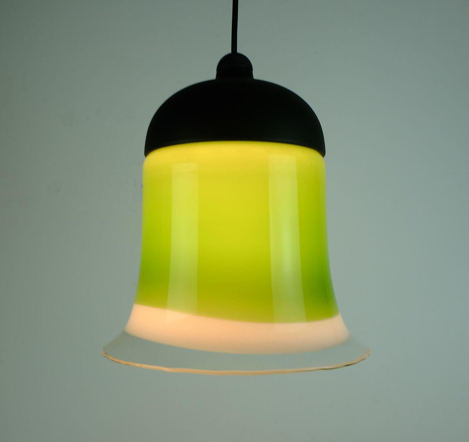 Very beautiful 1970s pendant lamp manufactured by Peill & Putzler. Model number AH 191. The shade is made of multicolored glass: green, white and clear. Black lacquered metal on top, black electric wire. Holds 1 E 27 bulb.

Measures: Overall