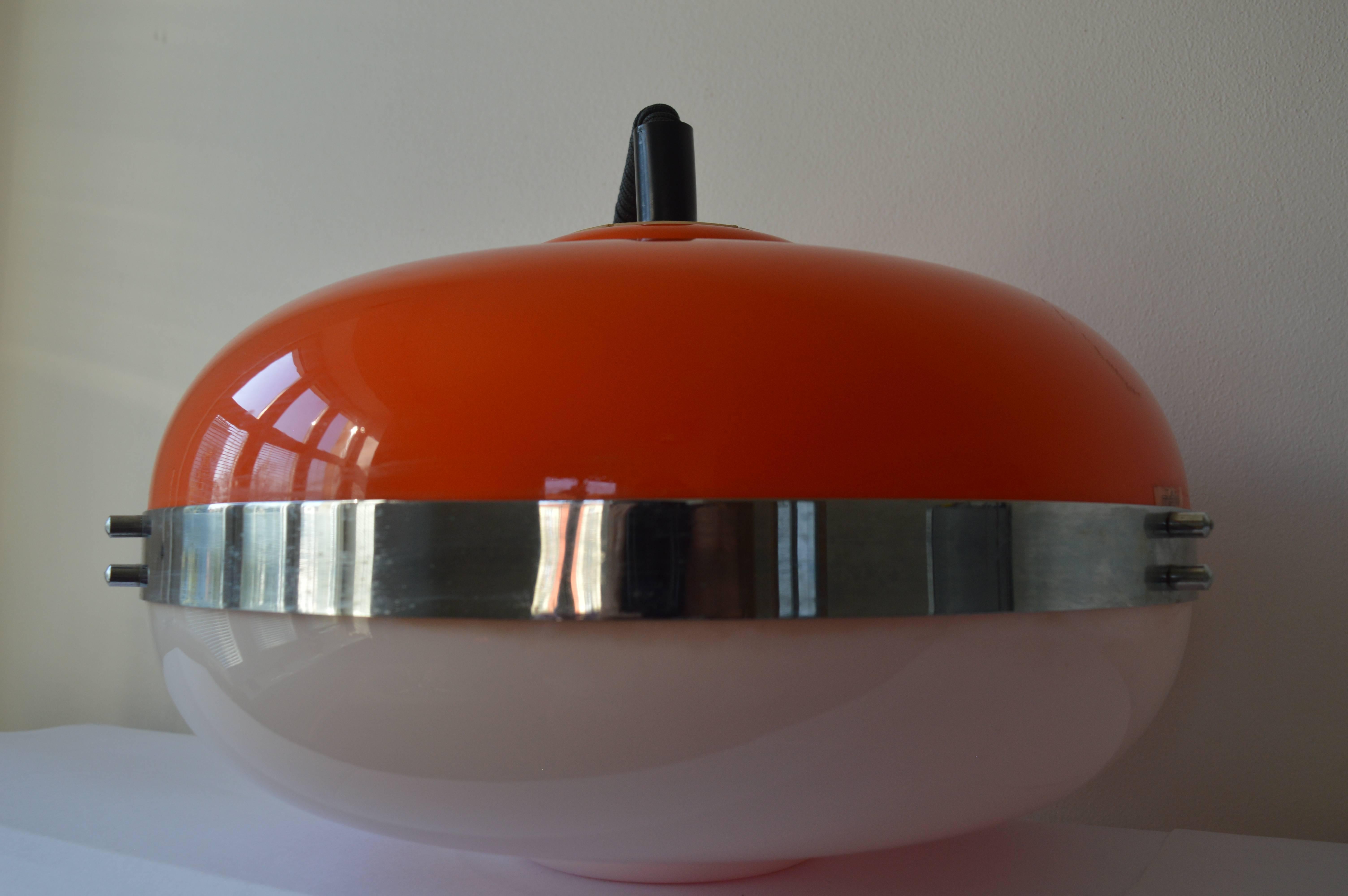 Midcentury pendant light UFO Meblo designed by Harvey Guzzini. Very nice style of lighting.