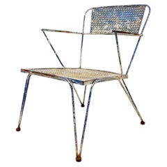 Mid-Century perforated metal armchair from the 1950s