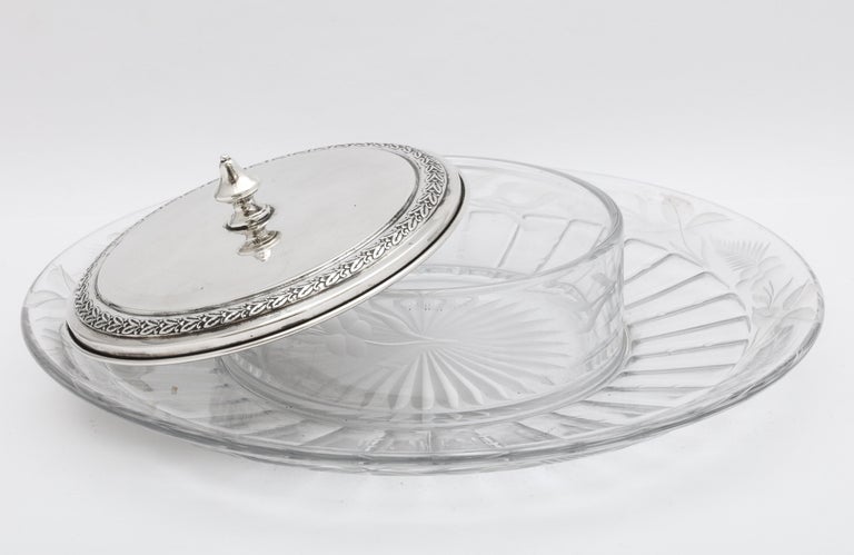 Mid-Century Modern period, sterling silver and glass hors d'oeuvres/caviar platter, the Watson Company, Attleboro, Mass., circa 1950s. Glass dip/caviar holder (which is part of the platter) is covered by a sterling silver lid. Glass border of