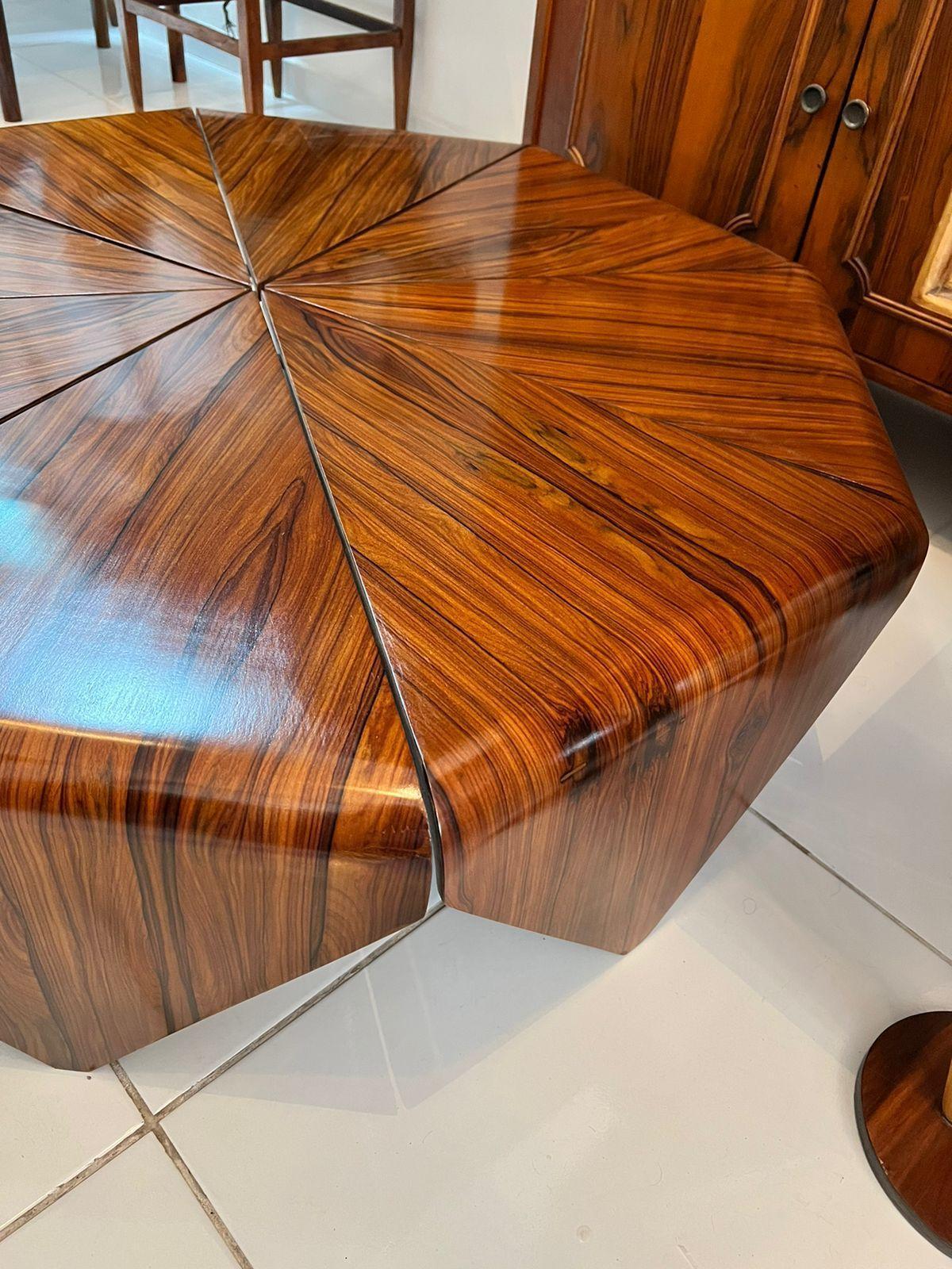 Original Petala Coffee Table, a masterpiece designed by Brazilian designer Jorge Zalszupin. Crafted from Pau Ferro, this table embodies sophistication.

This coffee table has been well-loved and shows its age. While it has 2 detached leaves and 1