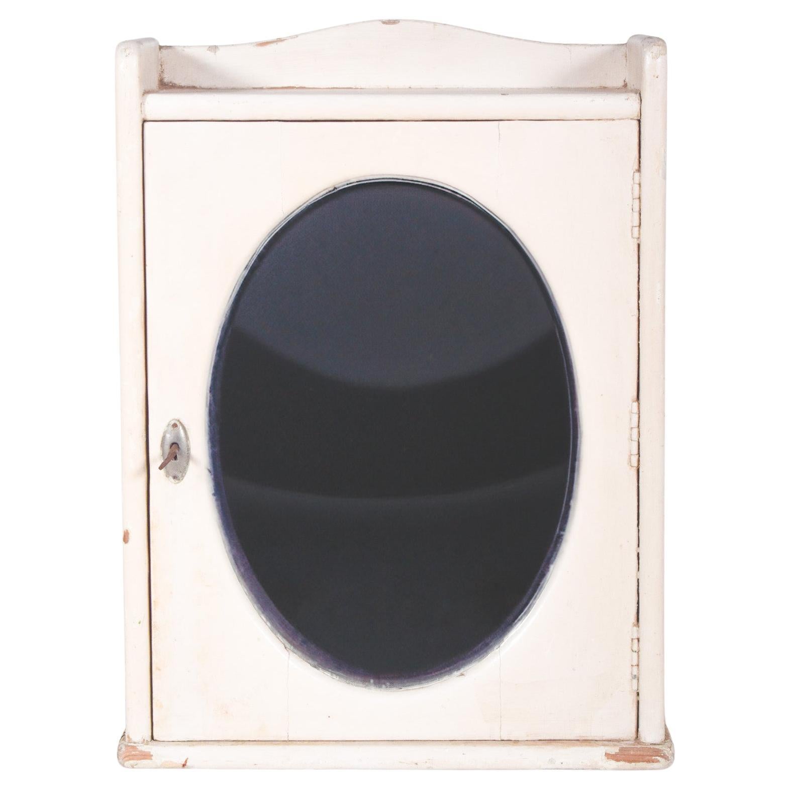 Mid-Century Pharmacy Cabinet with Oval Mirror For Sale